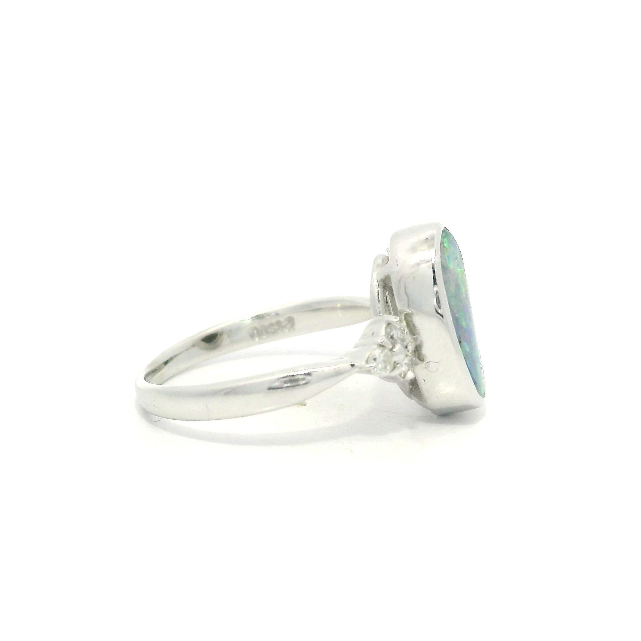 Platinum 2.29ctw Oval Bezel Boulder Opal w/ Diamond Cluster Accents Modern Ring For Sale 3