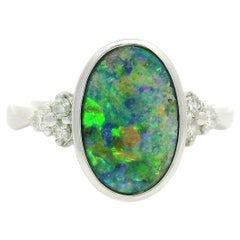 Platinum 2.29ctw Oval Bezel Boulder Opal w/ Diamond Cluster Accents Modern Ring