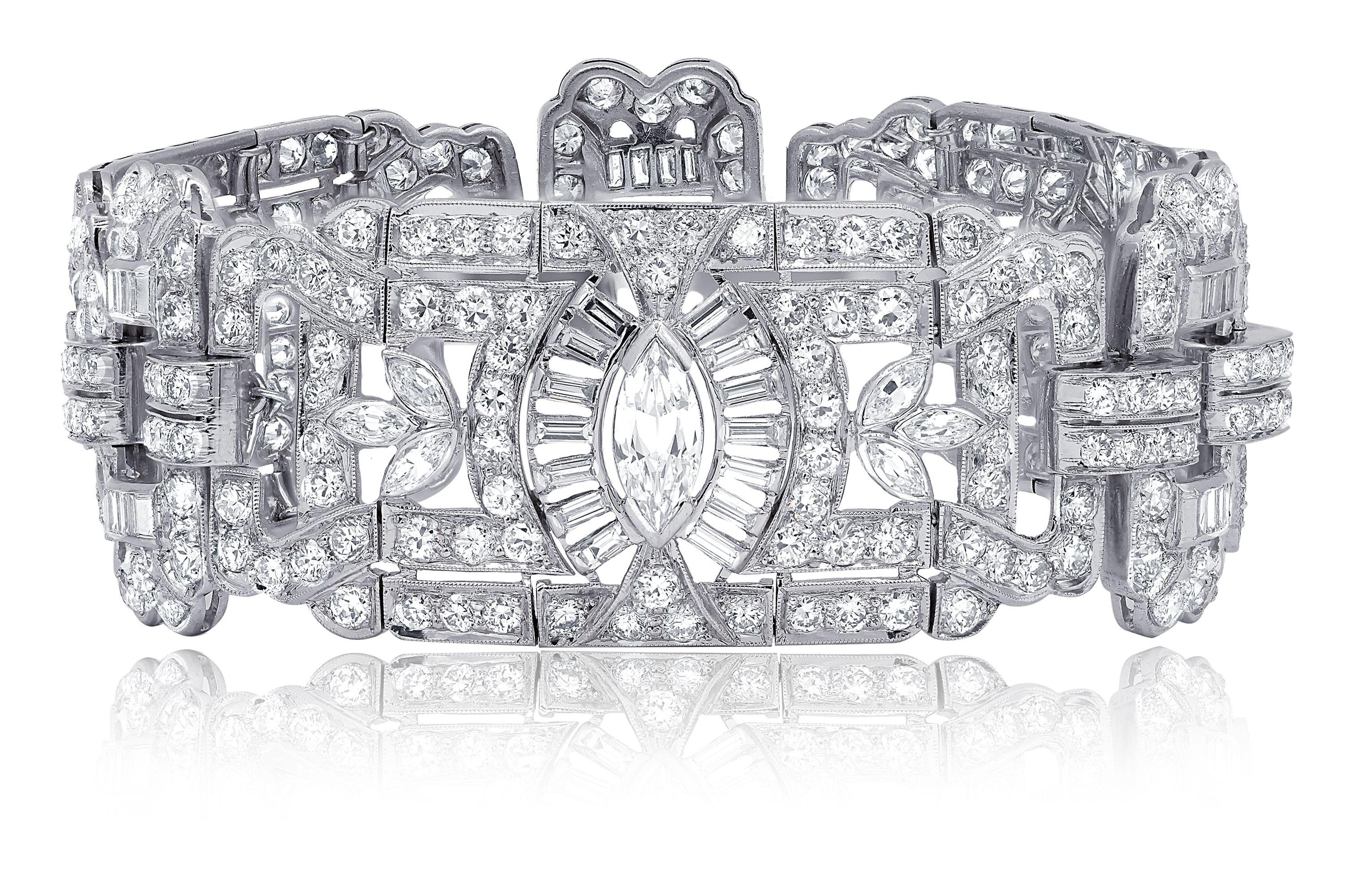 Deco Diamond bracelet with marquise, baguette and round diamonds. Three large marquise stone, total weight of diamonds 23.00 carats  
 Circa 1950's
Like new 