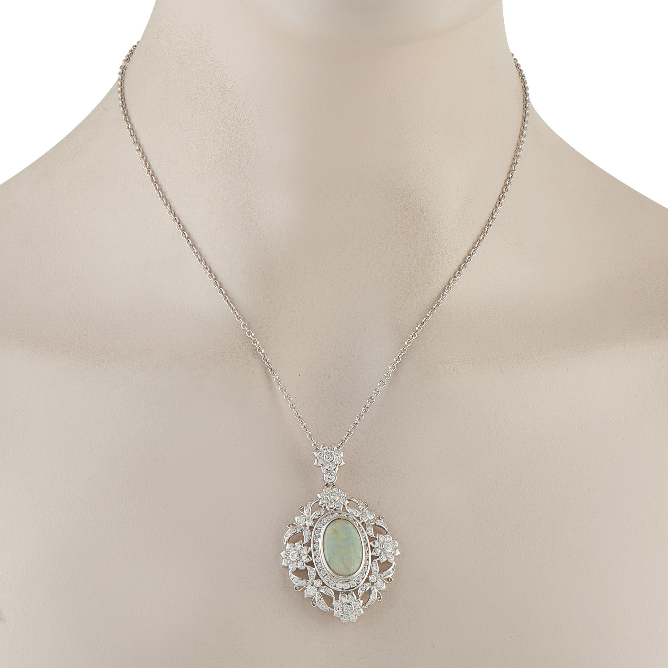 Bathed in the soft fire of a 4.2-carat opal, this necklace carries the quiet grandeur of a bygone era. The oval center stone is surrounded by a lace-like halo of 2.30 carats of diamonds, forming delicate floral accents that shimmer with grace.