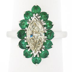 Platinum 2.30ct Marquise Light Yellow Diamond w/ Vivid Round Emerald Halo Ring