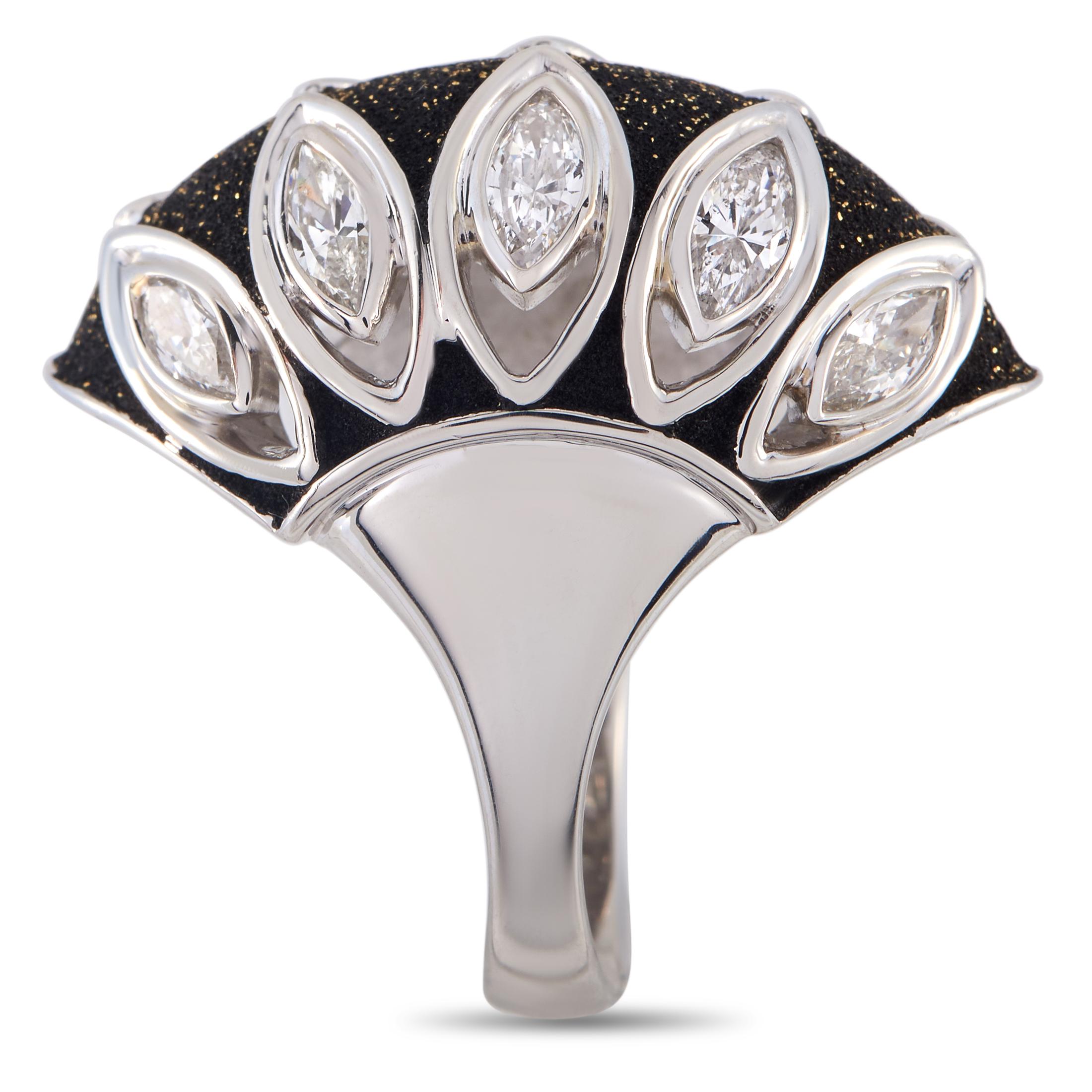 This ring presents a look that fuses drama with vintage charm. It features a sleek band in polished platinum, with broad shoulders that support a domed centerpiece. The elongated form of the ring's top follows the shape of half a football, with a