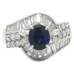 Platinum 2.45ctw Oval Blue Sapphire w/ Baguette Marquise 
Round Diamond Ring
