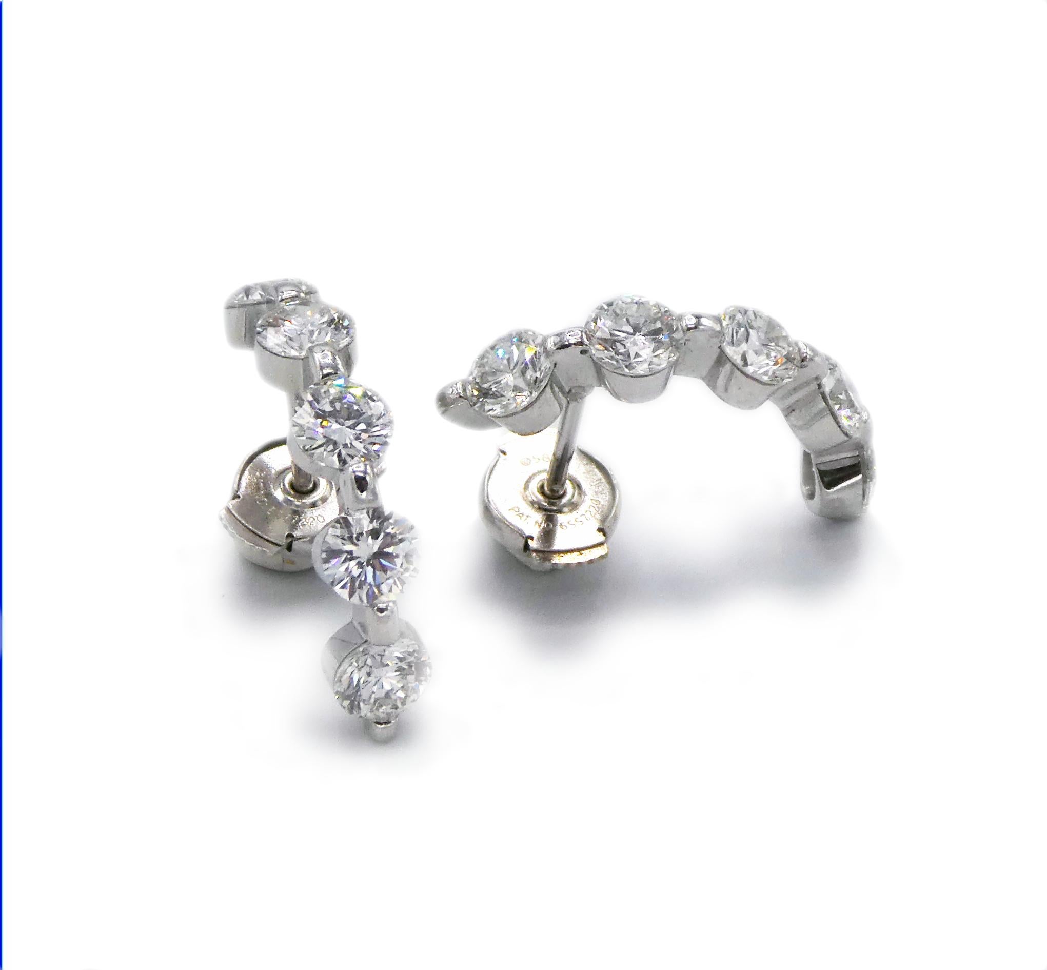 Platinum Diamond Half Hoop Earrings 2.50 CTW Diamonds

Metal: Platinum (backs are 14K)
Weight: 4.57 grams
Diamonds: 10 round brilliant cut diamonds, approx. 2.50 CTW, F-G VS
Length: 3/4 inch
