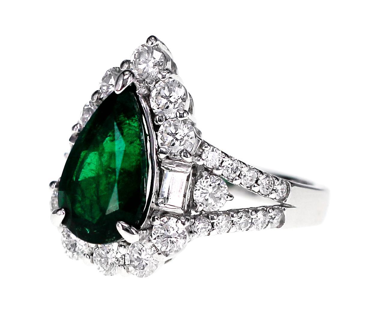 Set in Platinum ( PT 900 ), the ring is set with 2.63 carat of vivid green Zambian Emerald and 1.57 carat of D color VVS clarity diamond.
Ring Size: US 6