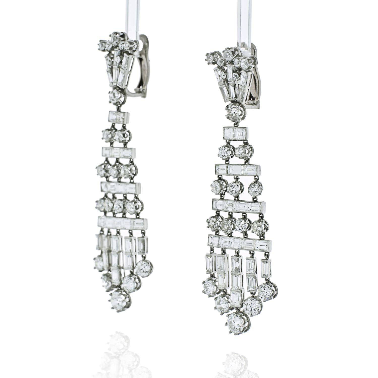 A magnificent pair of 26.50 carat diamond chandelier earrings. The earrings are comprised of old cut and baguette shaped diamonds weighing approximately 26.50 carats. The diamonds are G-H color and VS-SI clarity . These dramatic earrings exemplify