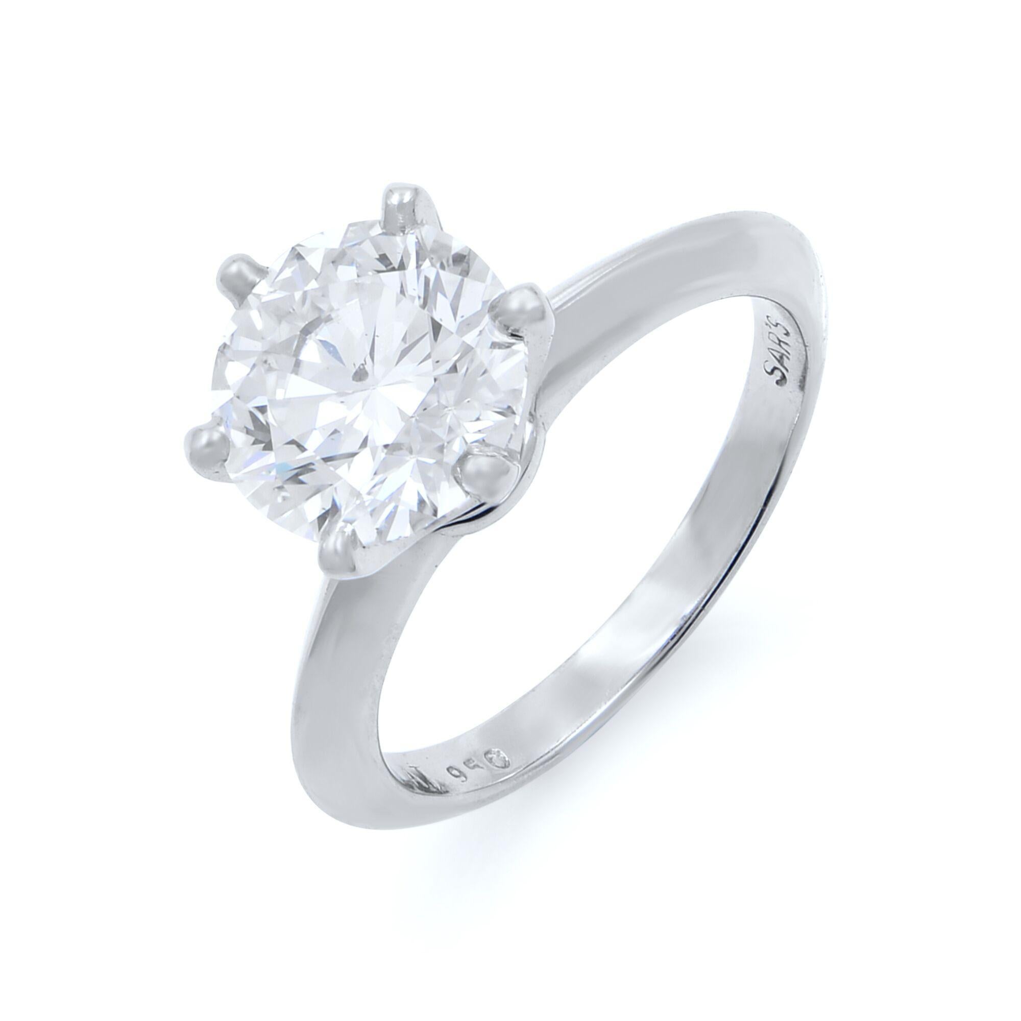 Hear her say yes to this amazing solitaire engagement ring. This ring is beautifully crafted in platinum 950. It showcases a magnificent 8.89 mm round brilliant 2.69 carat diamond. Standing tall in the traditional six-prong setting. This ring is