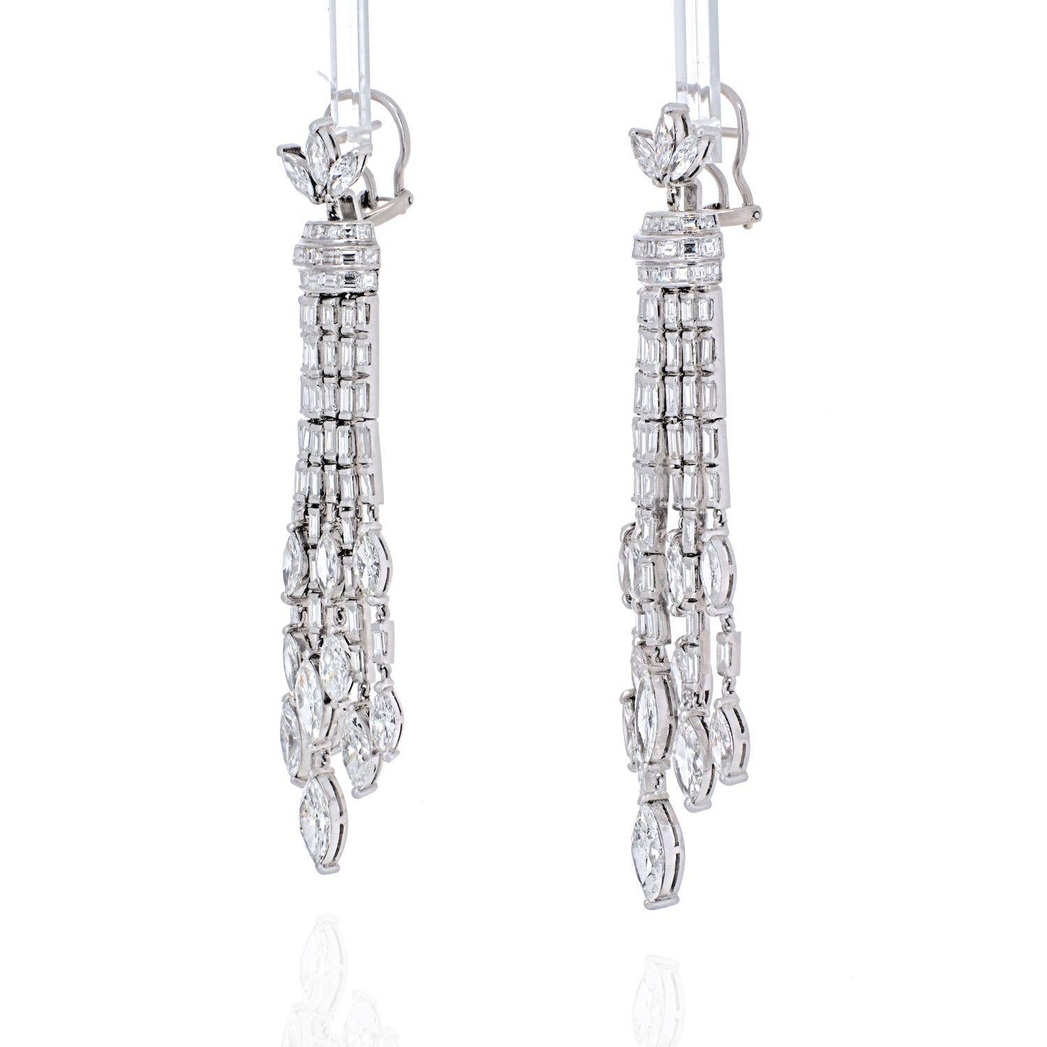 Make a compelling statement of fashion with these spectacular diamond drop earrings from our curated estate jewelry collection. Created in rich platinum, each dramatic chandelier-style drop showcases seven linear rows of shimmering baguette-cut and