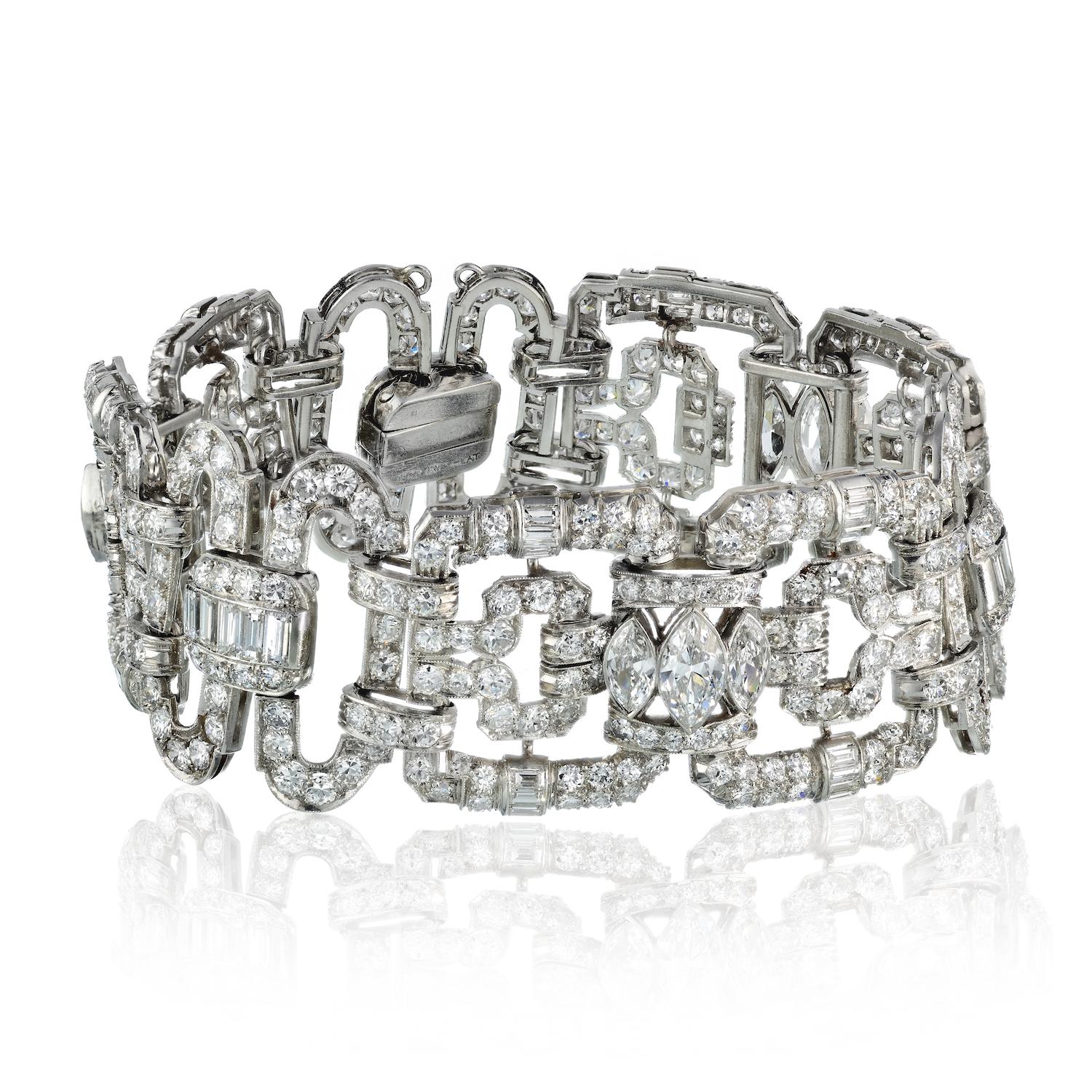 Elegance meets drama in this captivating heirloom bracelet, a true masterpiece of artful design. 

Embellished with a staggering 28.00 carats of multi-shaped diamonds, each stone showcases the impeccable qualities of F/G color and VS clarity. 

The