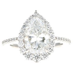 Platinum 2.87 Carat Pear Diamond Graduated Halo Engagement Ring