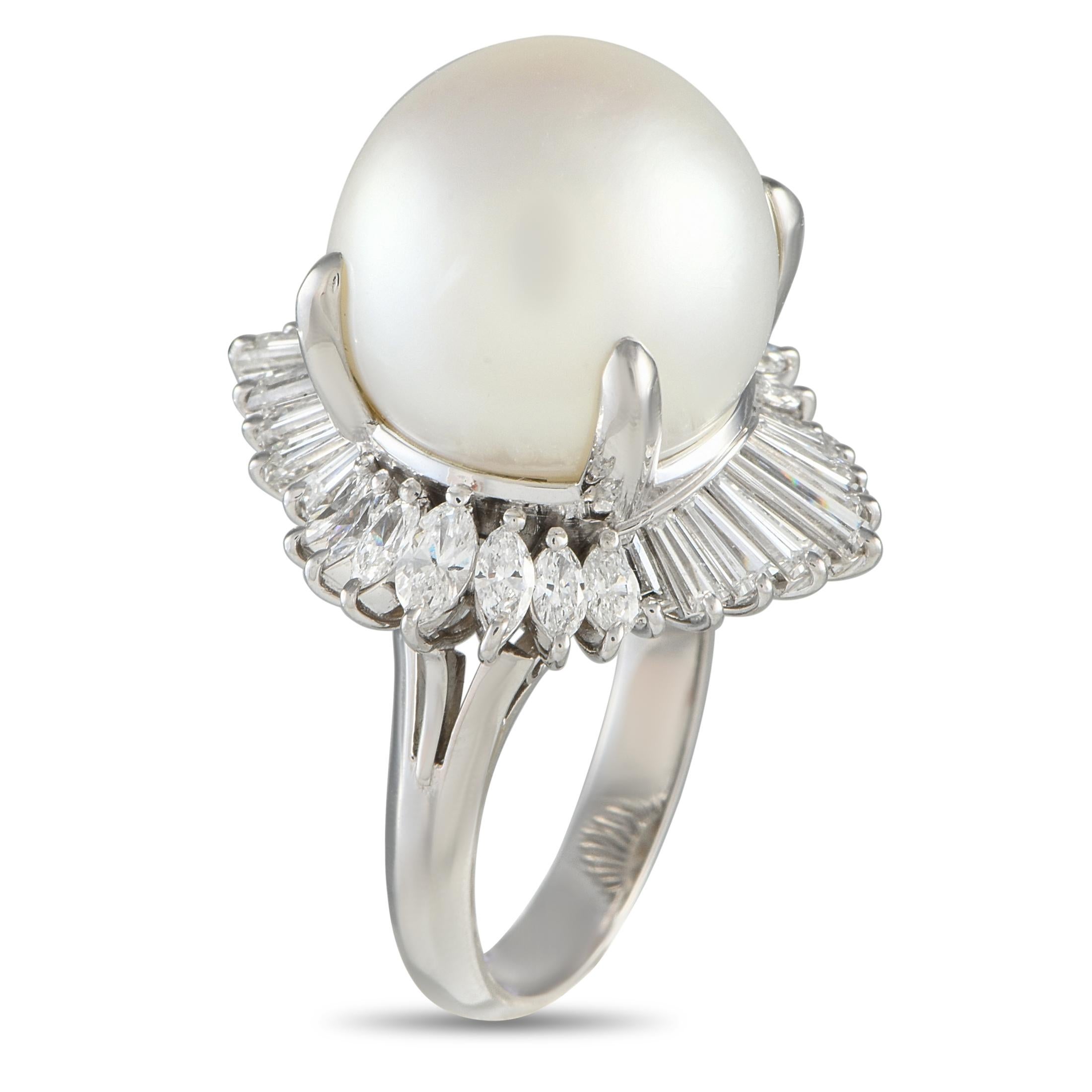 A breathtaking 15mm Pearl makes a statement at the center of this uniquely elegant ring. Crafted from Platinum, this piece shines to life thanks to a creative halo of Diamonds totaling 2.96 carats. Featuring a 5mm wide band and a 20mm top height, it