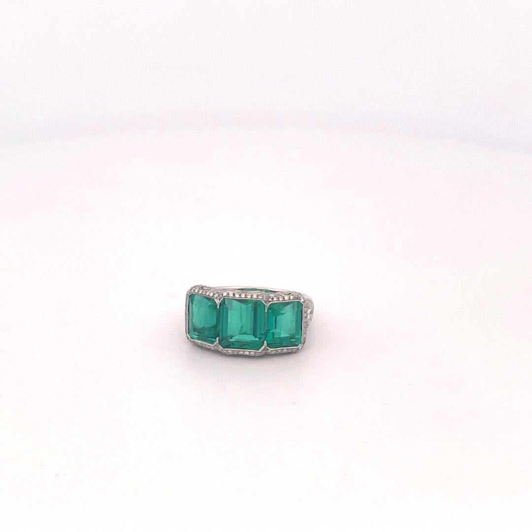Modern Platinum 3 Stone Colombian Emerald & Diamond Ring For Sale