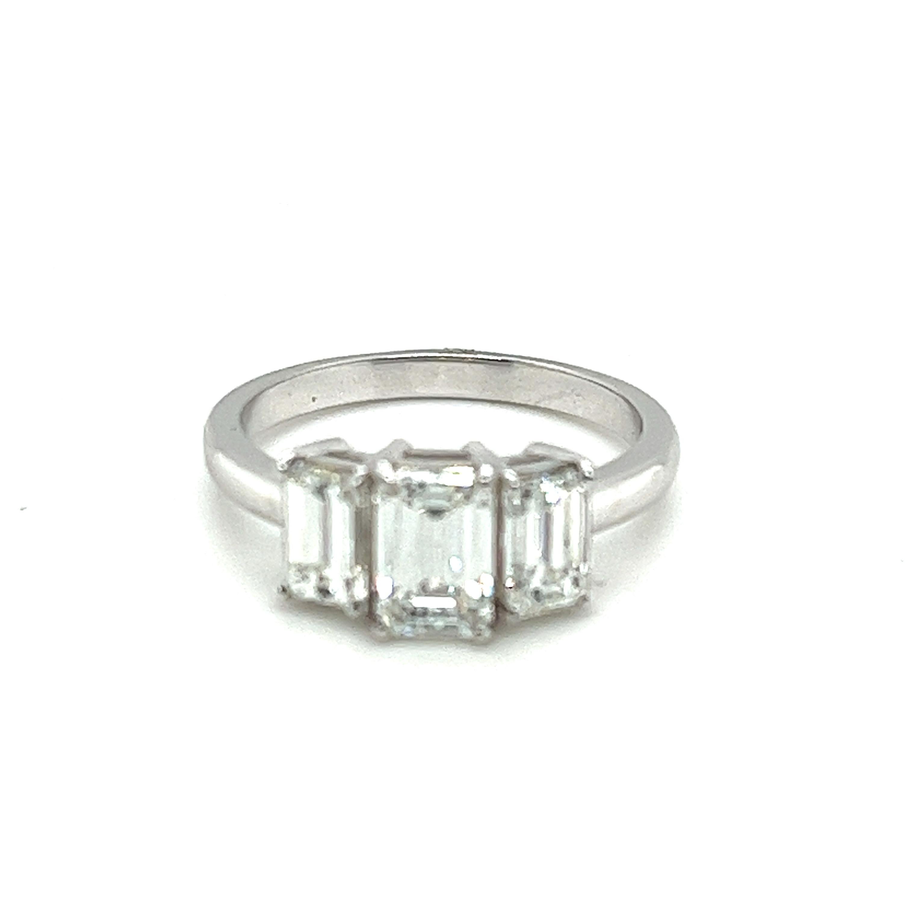 Contemporary Platinum 3 Stone Emerald Cut 2.25 Carats Diamonds Ring For Sale