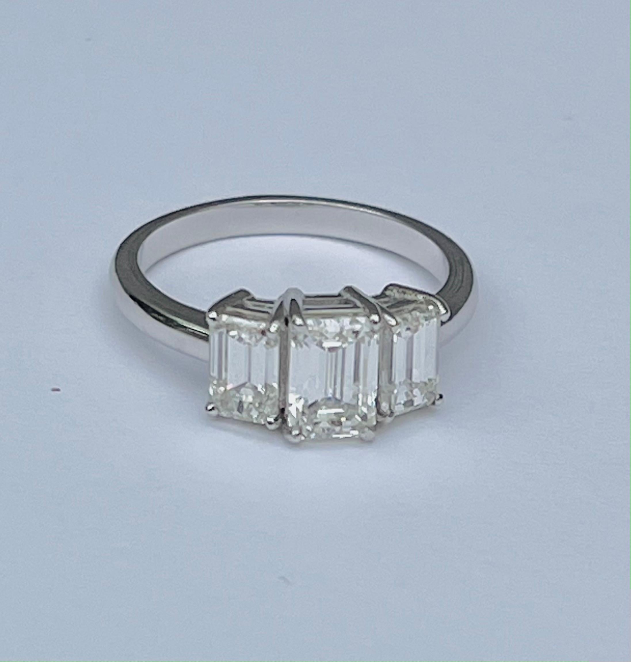 Platinum 3 Stone Emerald Cut 2.25 Carats Diamonds Ring For Sale 3