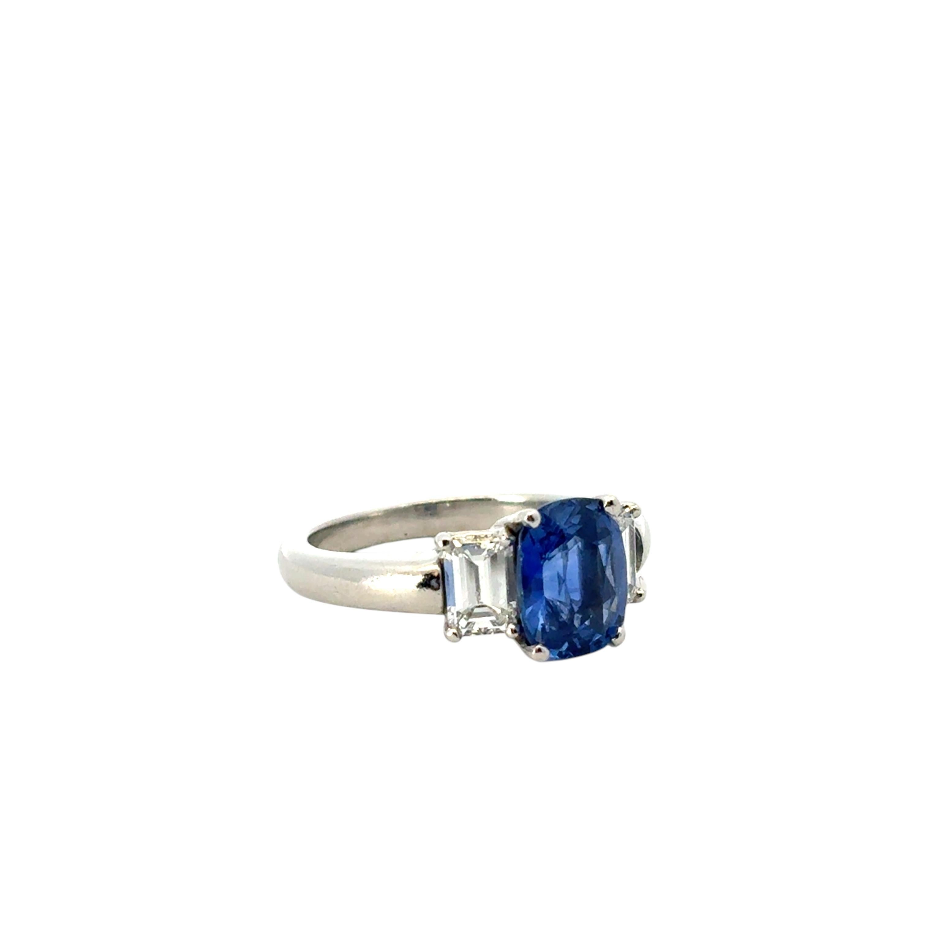 Modern Platinum 3 Stone Ring set with Natural Cushion Blue Sapphire and Side Diamonds For Sale