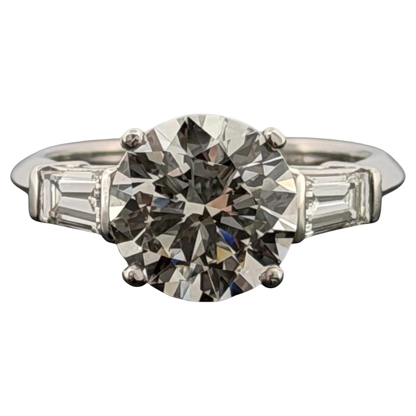 Platinum 3.01ct Round Brilliant Natural Diamond GIA Baguettes Three-Stone Ring For Sale