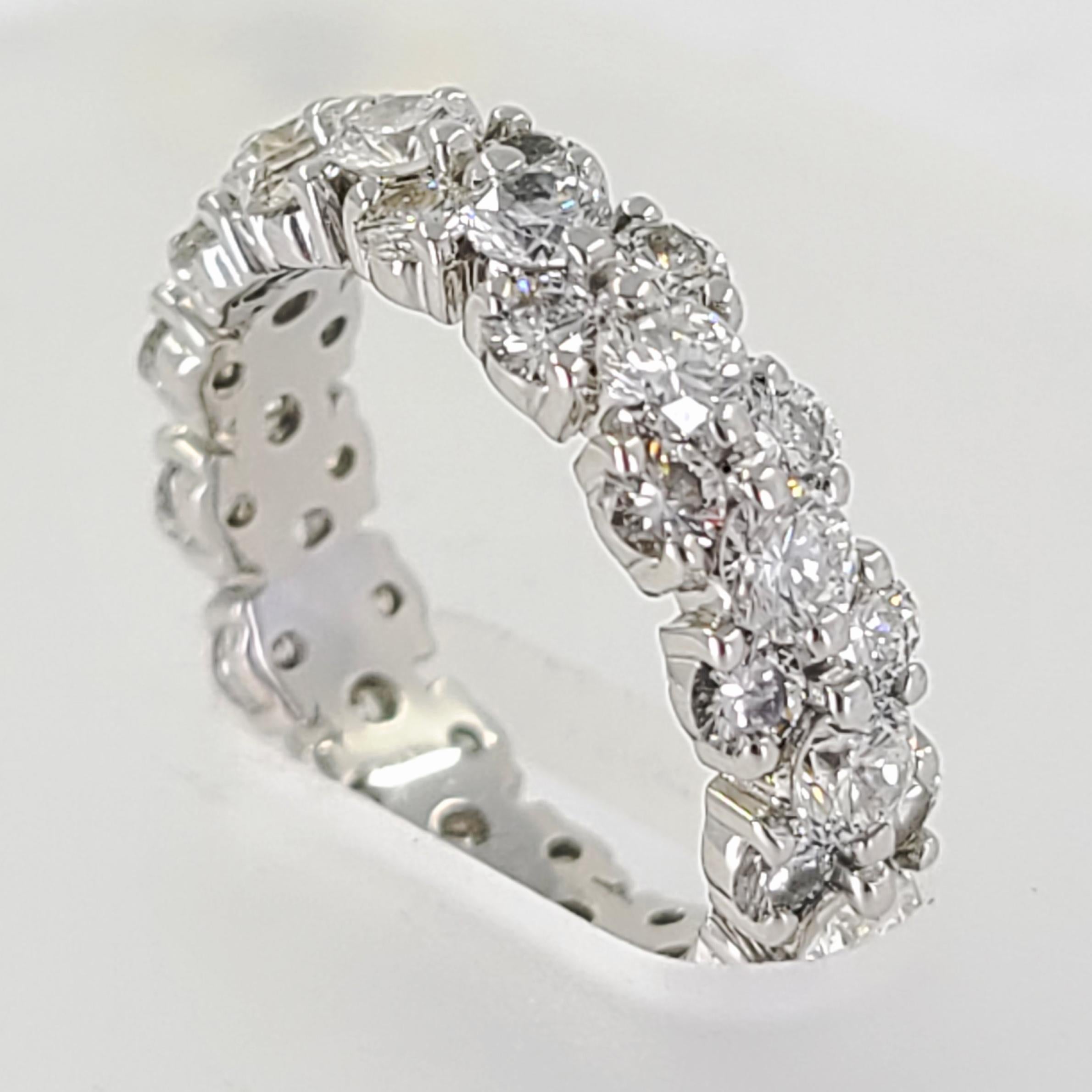 Platinum Diamond Eternity Band Featuring 3 Offset Stacked Shared-Prong Rows Of Round Brilliant Cut Diamonds. 45 Diamonds Of VS Clarity & G Color Total Approximately 3.05 Carats. Current Finger Size 5.5; Purchase Includes One Sizing Service. Note