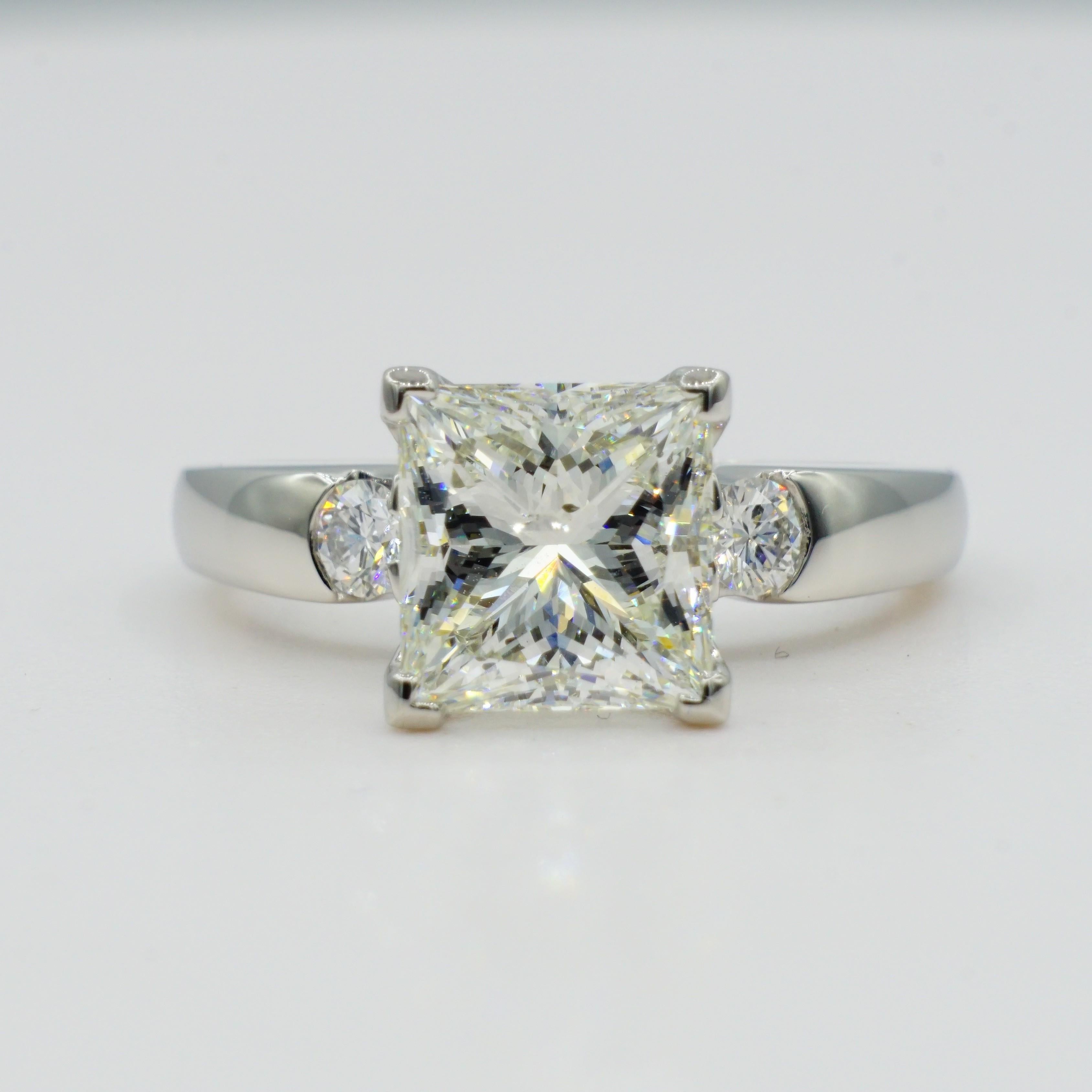 Platinum 3.06ct EGL Certified Princess Cut Diamond Wedding Set by Designer Rock N Gold Creations. This beautifully cut princess cut diamond center stone is H in color and SI2 in clarity and set in a four-prong chevron setting by our experienced