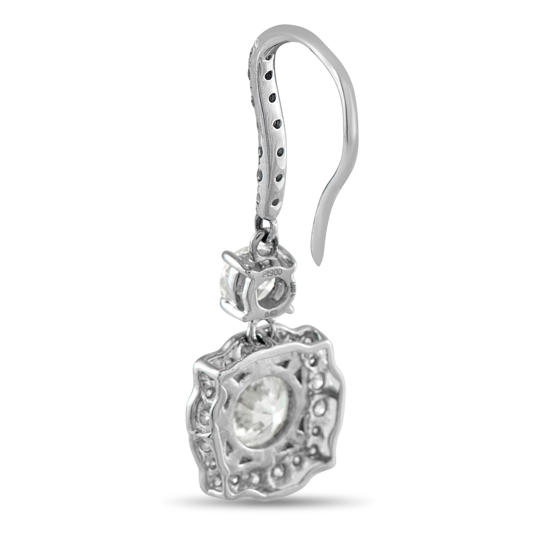 These opulent luxury earrings will never go out of style. Set in shimmering Platinum, a 1.0 carat round-cut Diamond and a 1.07 carat round-cut Diamond make a statement at the center of each earring. Additional Diamond accents with a total weight of