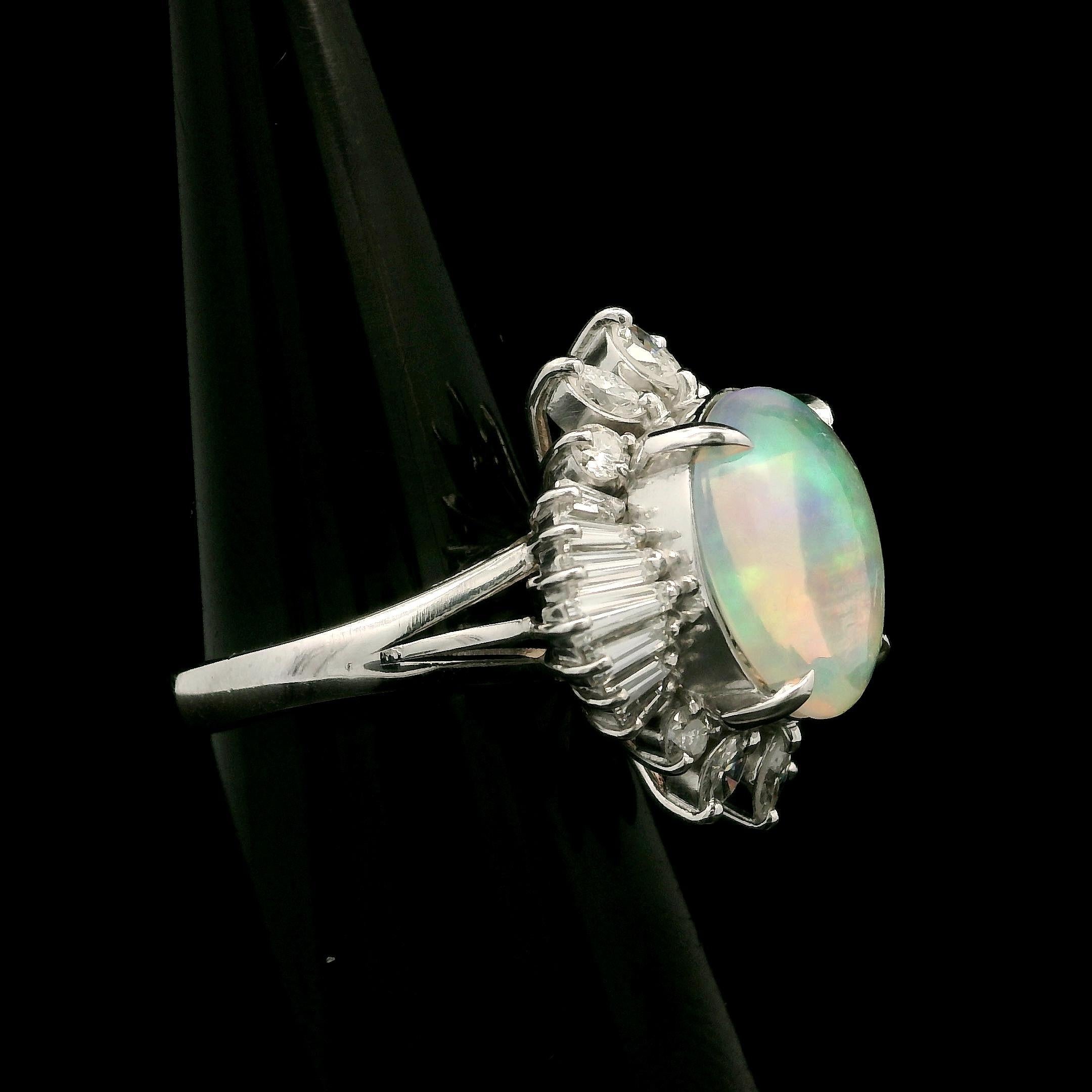 --Stone(s):--
(1) Natural Genuine Opal - Oval Cabochon Cut - Prong Set - Clear w/ Amazing Fiery Play of Colors- 11.9x9.5mm (approx.) - 2.49ct (exact)
Numerous Natural Genuine Diamonds - Marquise & Baguette Cut - Prong Set - Nice Brilliant White