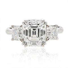 Antique Platinum 3.44 Carat D/VVS2 Three Stone Emerald Cut Diamond Engagement Ring