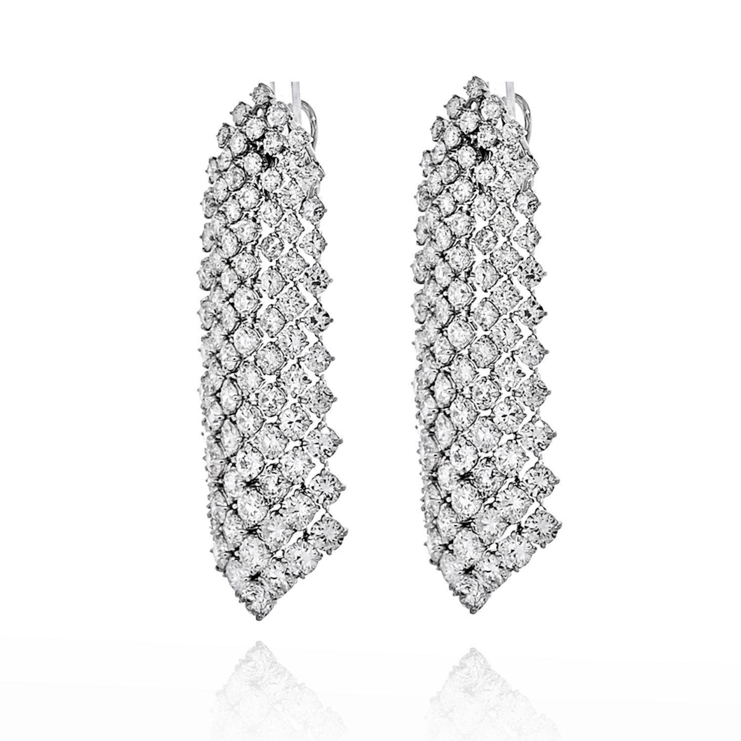 Absolutely stunning these earrings will stop traffic. Crafted in Platinum with rows of cascading round cut diamonds these dangling chandeliers is exactly what you need for your special event. Mounted with 35 carats of round cut diamonds, all of