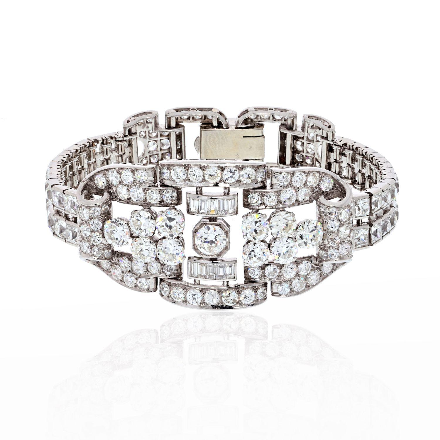 This particular piece is a perfect example of Art Deco craftsmanship and elegance! The bracelet is designed in platinum as an openwork panel that graduates from a central plaque featuring a series of old cut diamonds with a further embellishment of