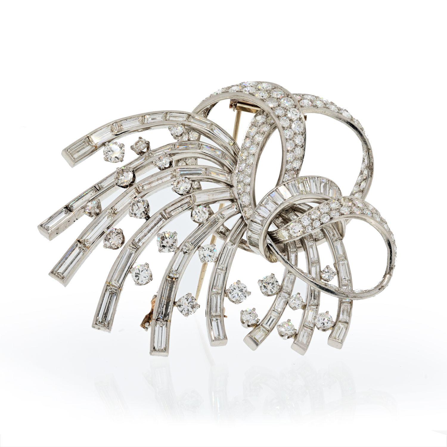 Crafted in platinum and encrusted with lots of diamonds this brooch is all fire! You will absolutely love it the moment you see it in person. Made in solid platinum this brooch weighs 60 grams! And wait till you see the sparkle! With over 35 carats