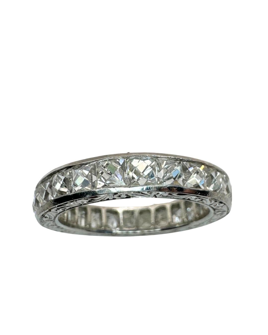 Indulge in our Platinum 3.50 Carat Repurposed Diamond Hand Engraved Eternity Band. Expertly crafted from repurposed french cut diamonds and on platinum, these rings are both sustainable and stunning. The diamonds weigh 3.50 carats in