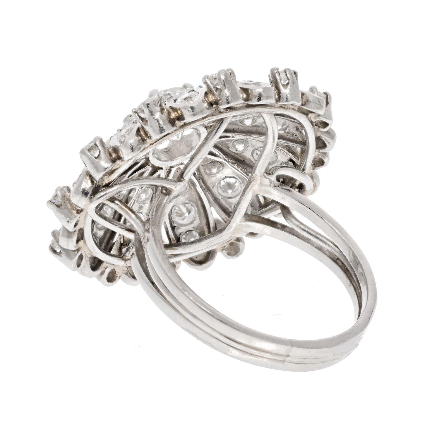 When shopping for a vintage ring, one that truly encapsulates the elegance and significance of a bygone era is the Platinum 3.54cttw Diamond Flower Motif Ring from the 1940s. This period in jewelry design holds particular charm and importance,