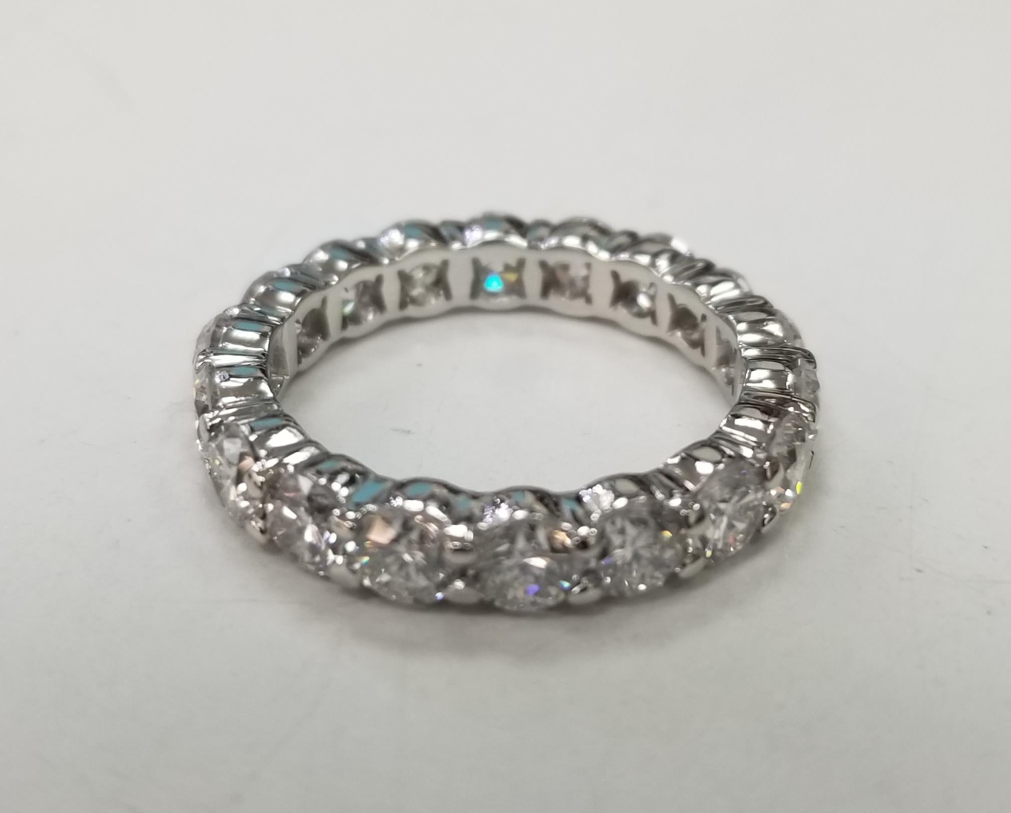 Platinum 3.65 Carats diamond eternity ring set with shared prongs
Specifications:
    main stone: BRILLIANT CUT DIAMOND
    diamonds: 19 PIECES
    carat total weight: 3.65
    color:  F-G
    clarity: VS1 
    metal: Platinum
    width: 3mm
   