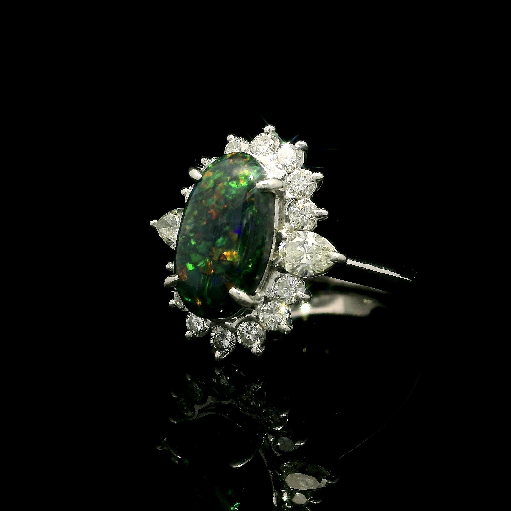 MUST SEE OPAL IN PERSON
--Stone(s):--
(1) Natural Genuine Opal - Elongated Oval Cabochon Cut - Prong Set - Black Color w/ Wonderful Play of Color - 12.65 x 7.29 x4.49 mm / 2.57ct (exact - stamped)
**See Certification Details Below For More