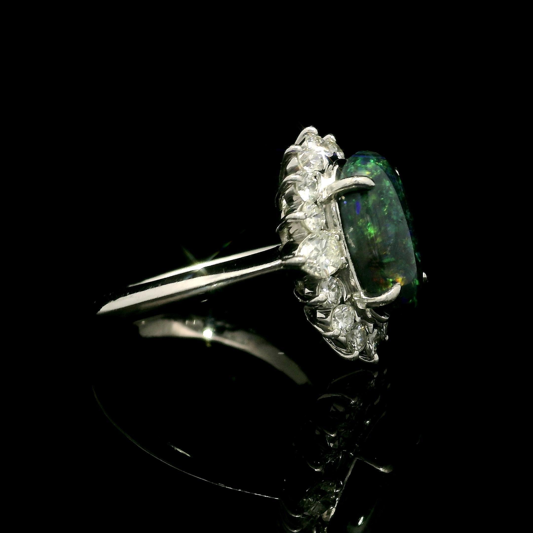 Platinum 3.65ctw GIA Elongated Oval Black Opal w/ Diamond Halo Nice Shape Ring In Excellent Condition For Sale In Montclair, NJ