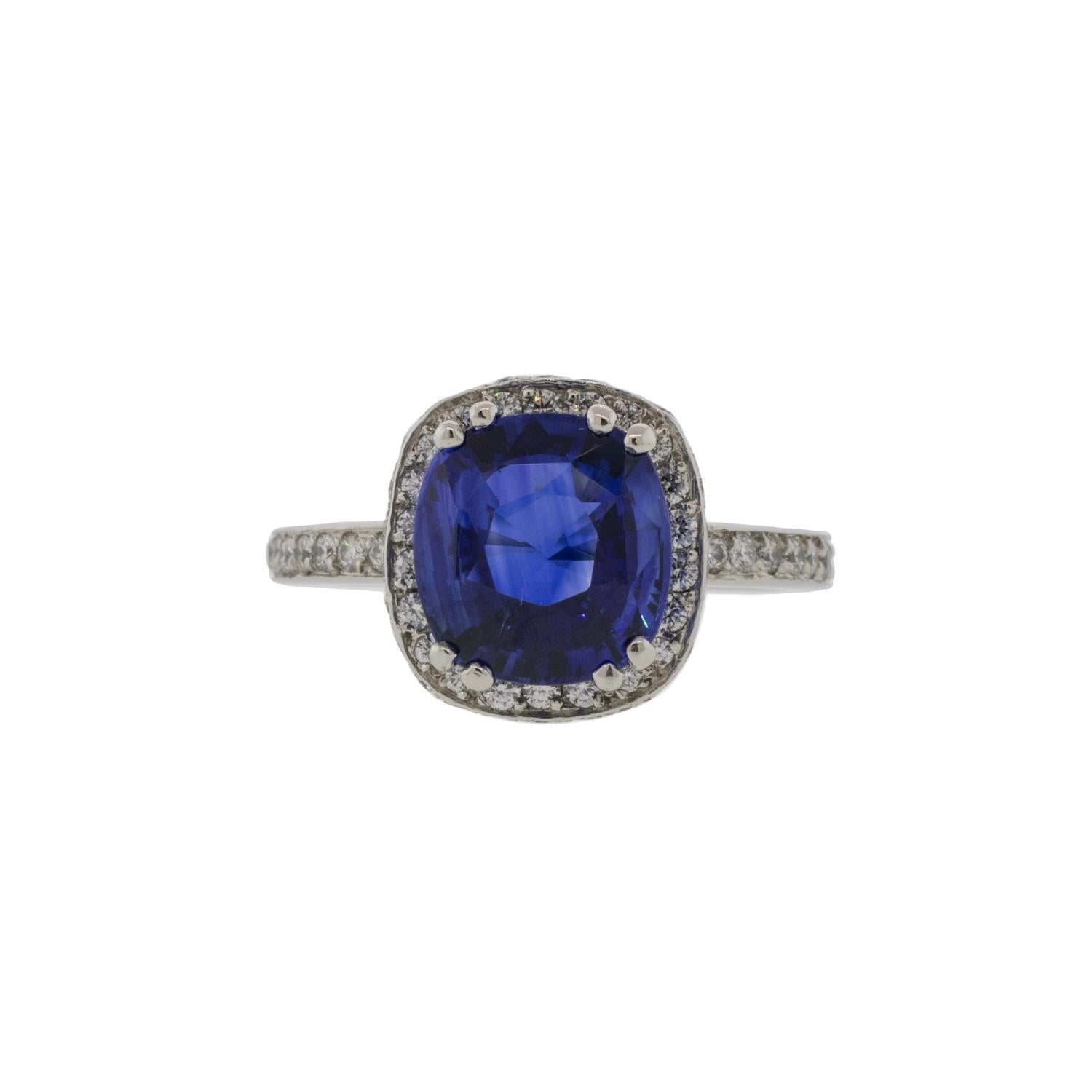 A gorgeous estate find, that is a total showstopper. The 3.67ct Sapphire is prong set securely to a platinum band. The halo and band is decorated with collection of melee diamonds ranging from G-H in color and VS2-SI1 in clarity with the total