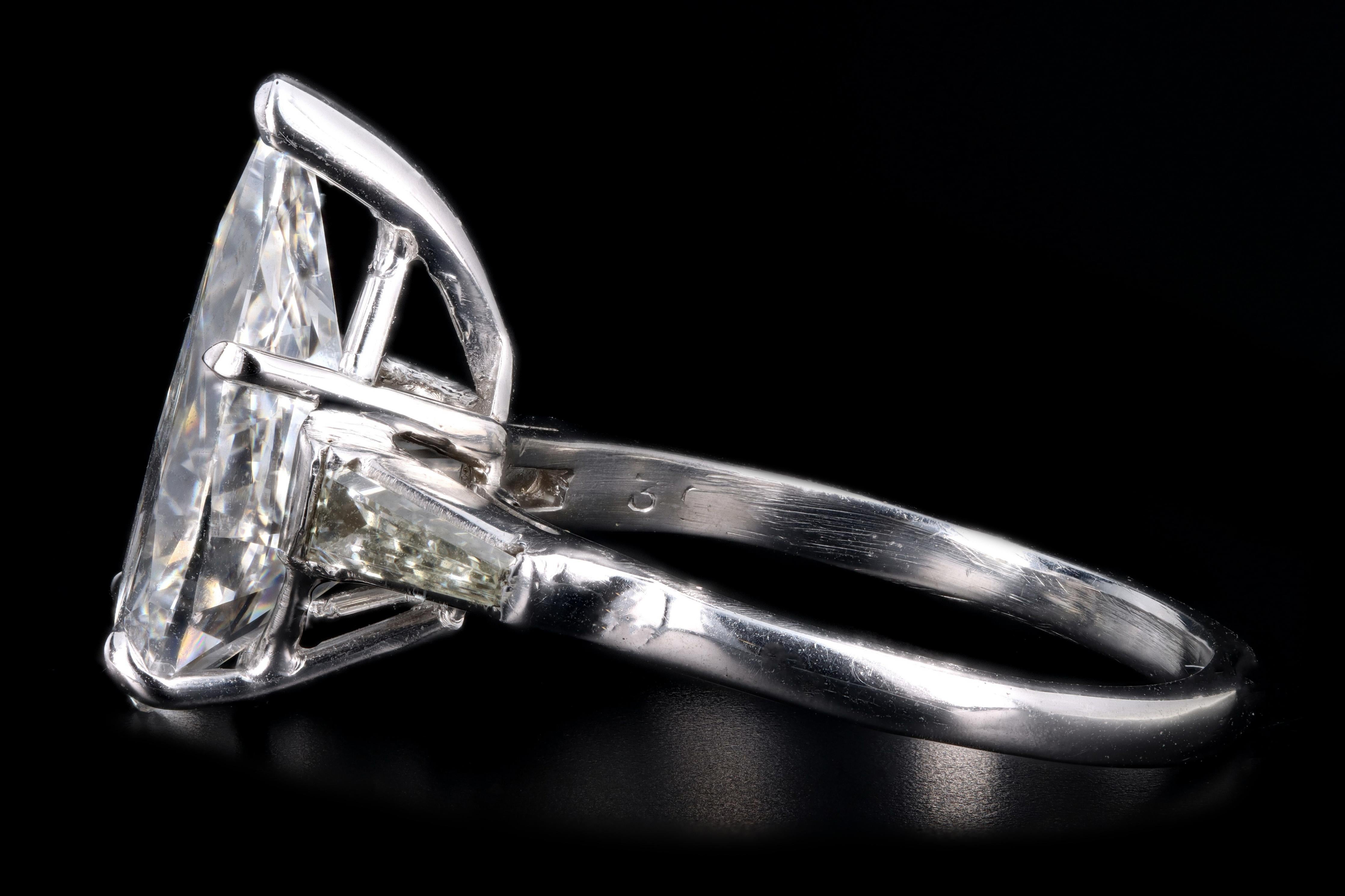 Era: New

Composition: Platinum

Primary Stone: Pear Cut Diamond

Carat Weight: 3.68 Carat

Color: E

Clarity: VS2

Secondary Stone: Tapered Baguette Diamonds

Carat Weight: Approximately .10 Carats

Color: H

Clarity: VS2

Total Carat Weight: