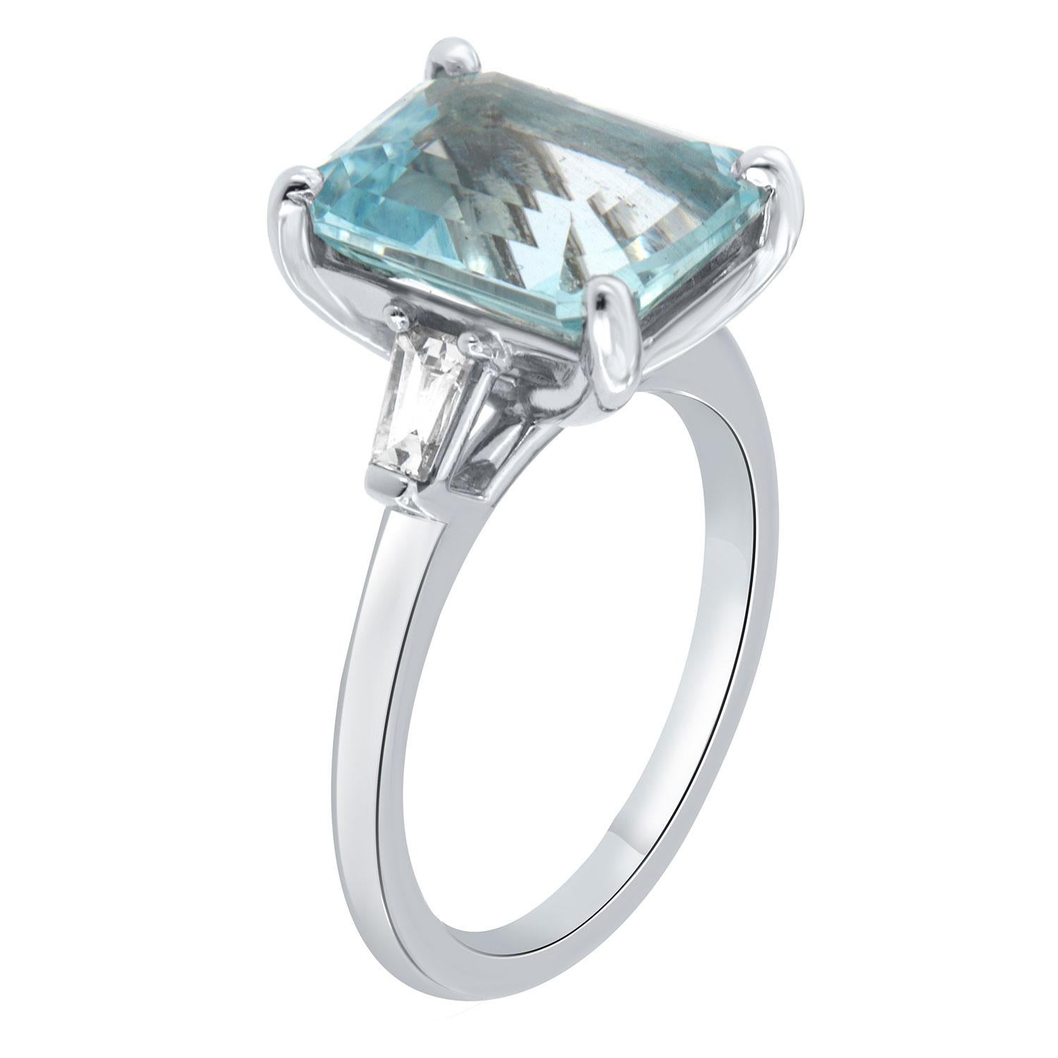 This timeless Three-Stone platinum ring features a 3.73- Carat Sky Blue Color Emerald -Shaped Aquamarine flanked by two Tapered Baguette diamonds ideally situated to enhance the brilliance of the Aquamarine. The total weight of the Tapered Baguette