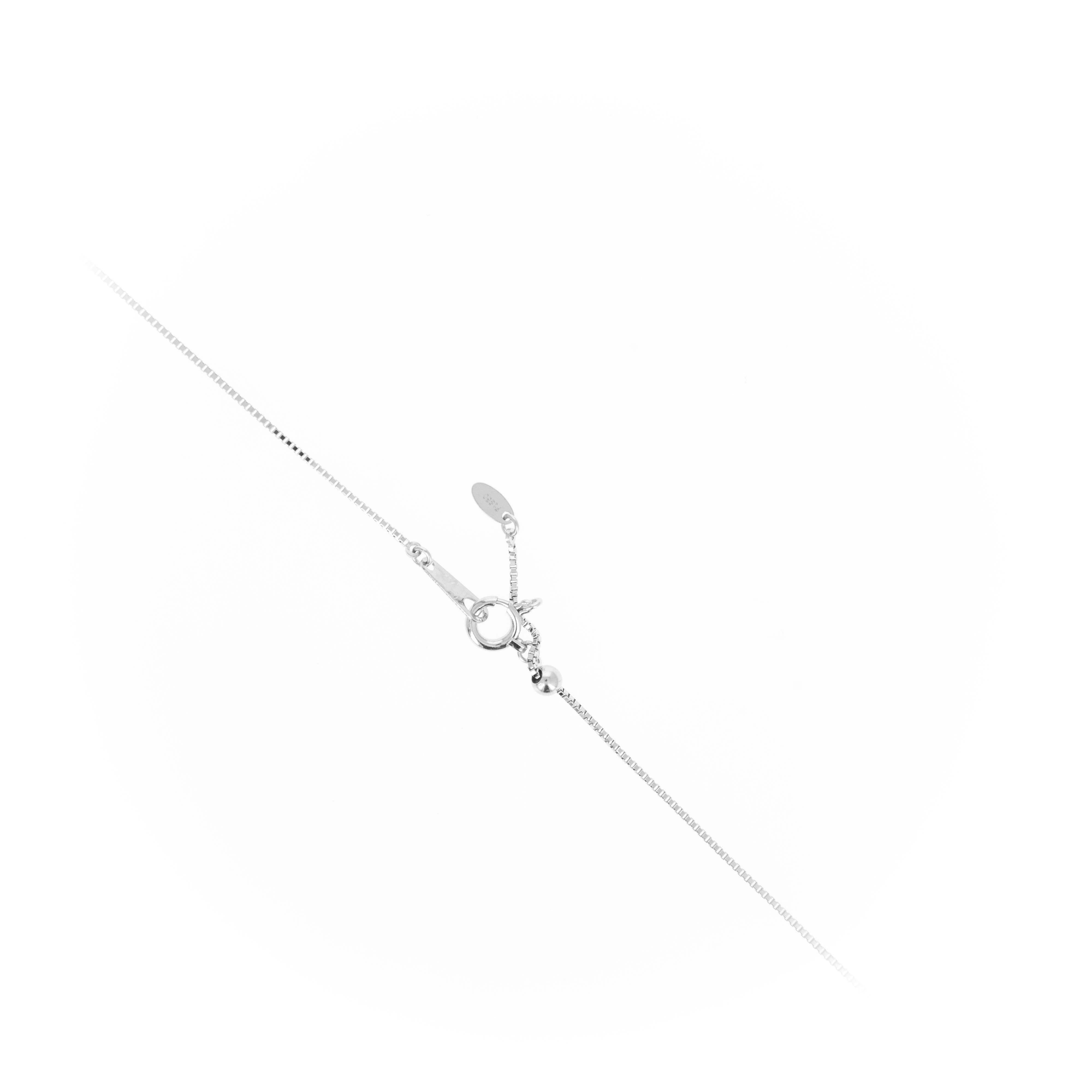 Era: Modern Estate

Composition: Platinum
Primary Stone: Modified Rectangular Cut Green Tourmaline
Carat Weight: 3.75 Carats
Accent Stone: Two Round Brilliant Diamonds
Carat Weight: 0.11 Carats in Total
Color/Clarity: F-G / VS2
Necklace Length: