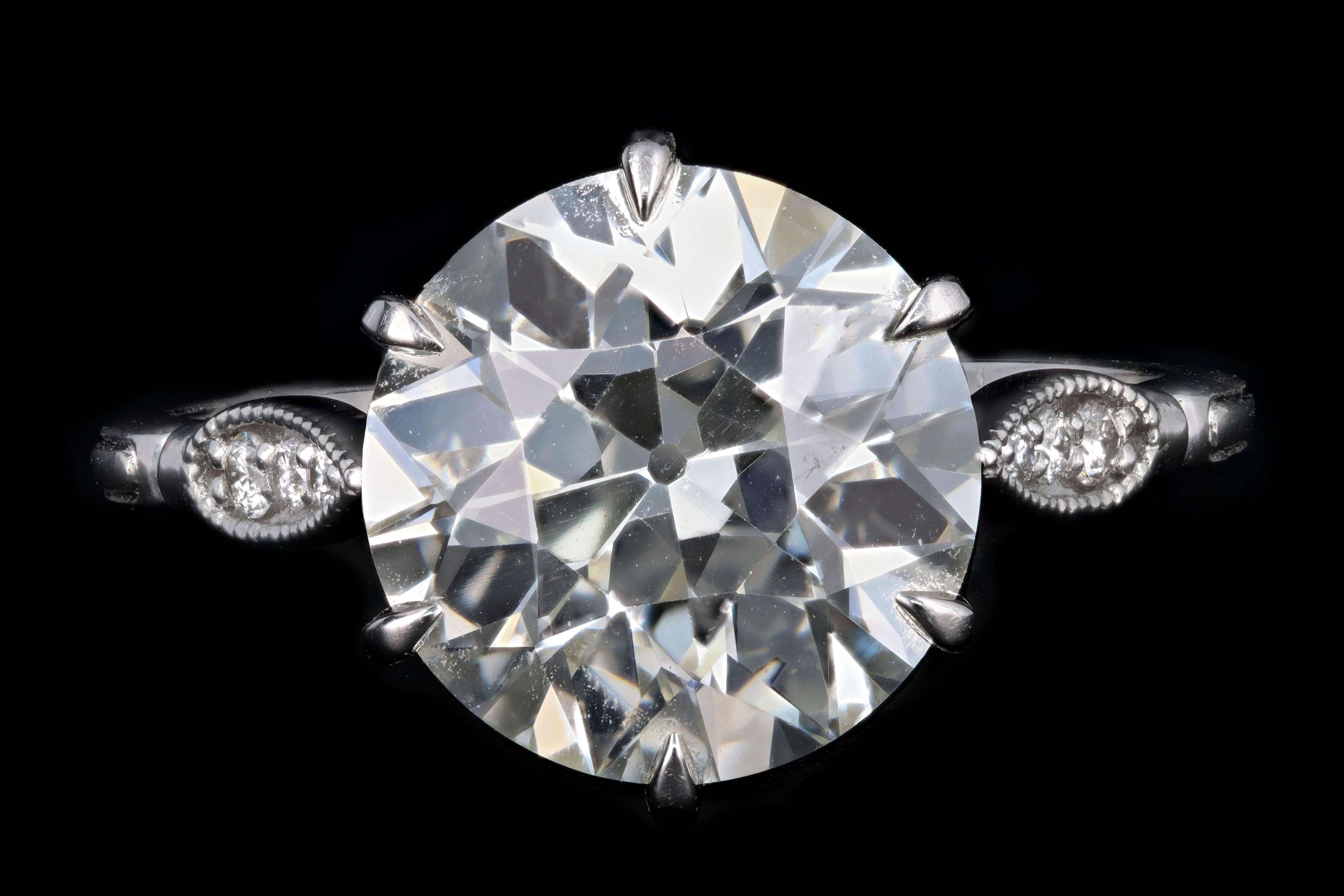 Era: New Vintage Inspired

Composition: Platinum

Primary Stone: Old European Cut Diamond

Carat Weight: 3.75 Carats

Color/Clarity: K / VS1

Accent Stone: Round Brilliant Diamonds

Carat Weight: .057 Carat Total

Color/Clarity: G/H - VS1/2

Total