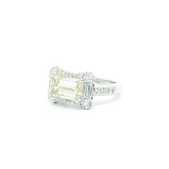 Platinum 3.87ctw GIA Faint Yellow Emerald Cut Diamond East West Bow Band Ring