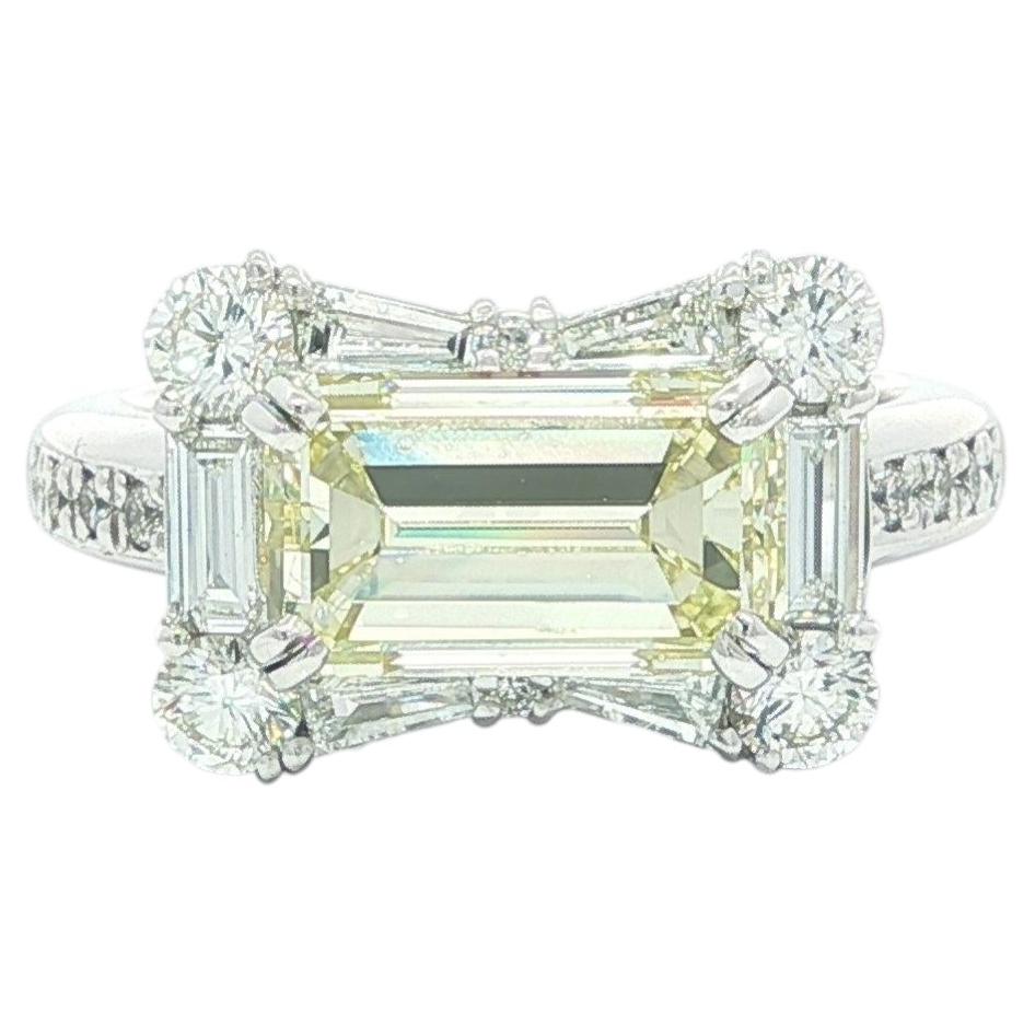 Platinum 3.87ctw GIA Faint Yellow Emerald Cut Diamond East West Bow Band Ring