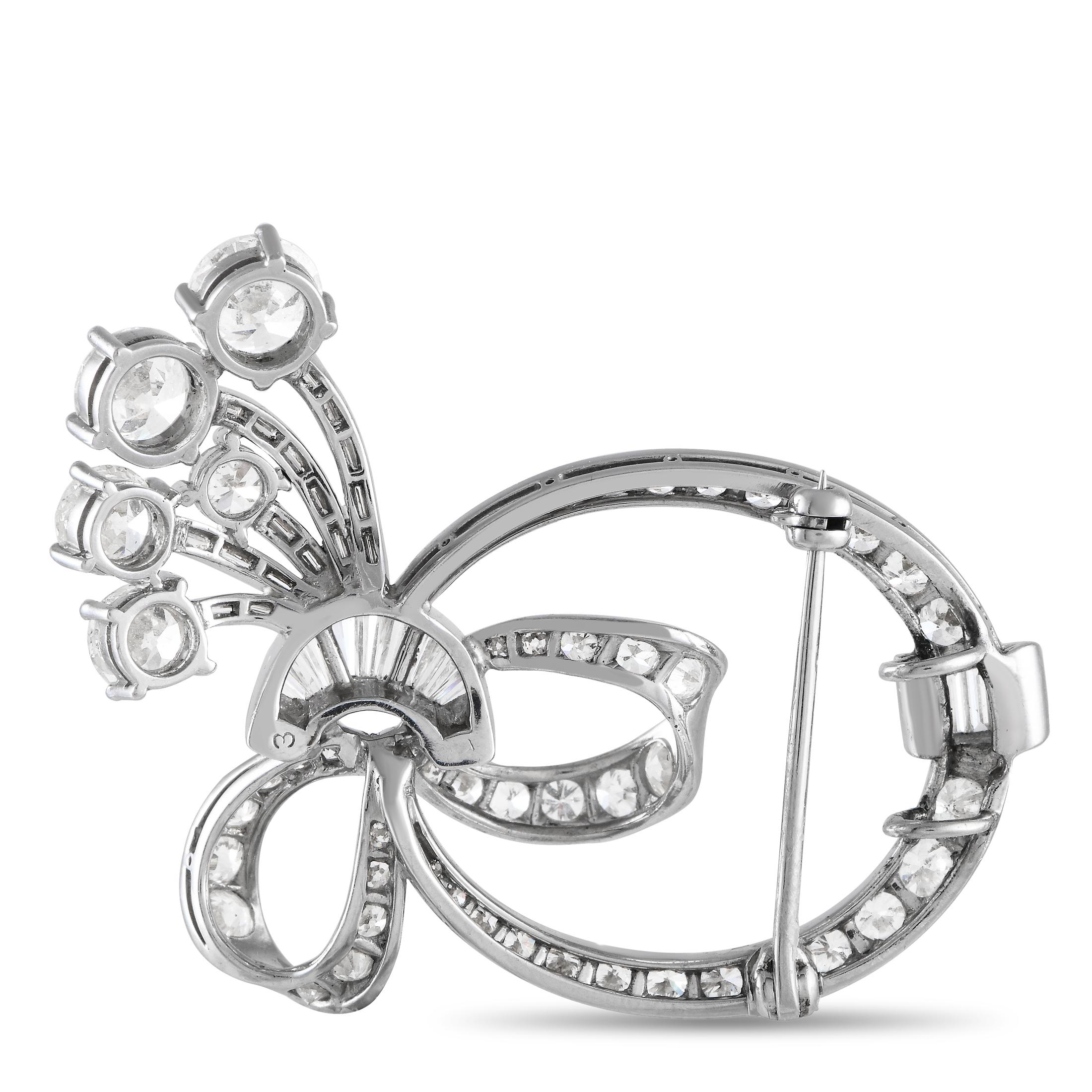 Diamonds with a total weight of 3.90 carats allow this beautiful brooch to effortlessly emanate light. The platinum setting features gracefully curved lines that will instantly capture your imagination. It measures 1.65 long by 1.45 wide.This