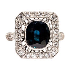 Bague en platine avec saphir taille coussin de 3,97 carats et grappe de diamants de 0,64 carat