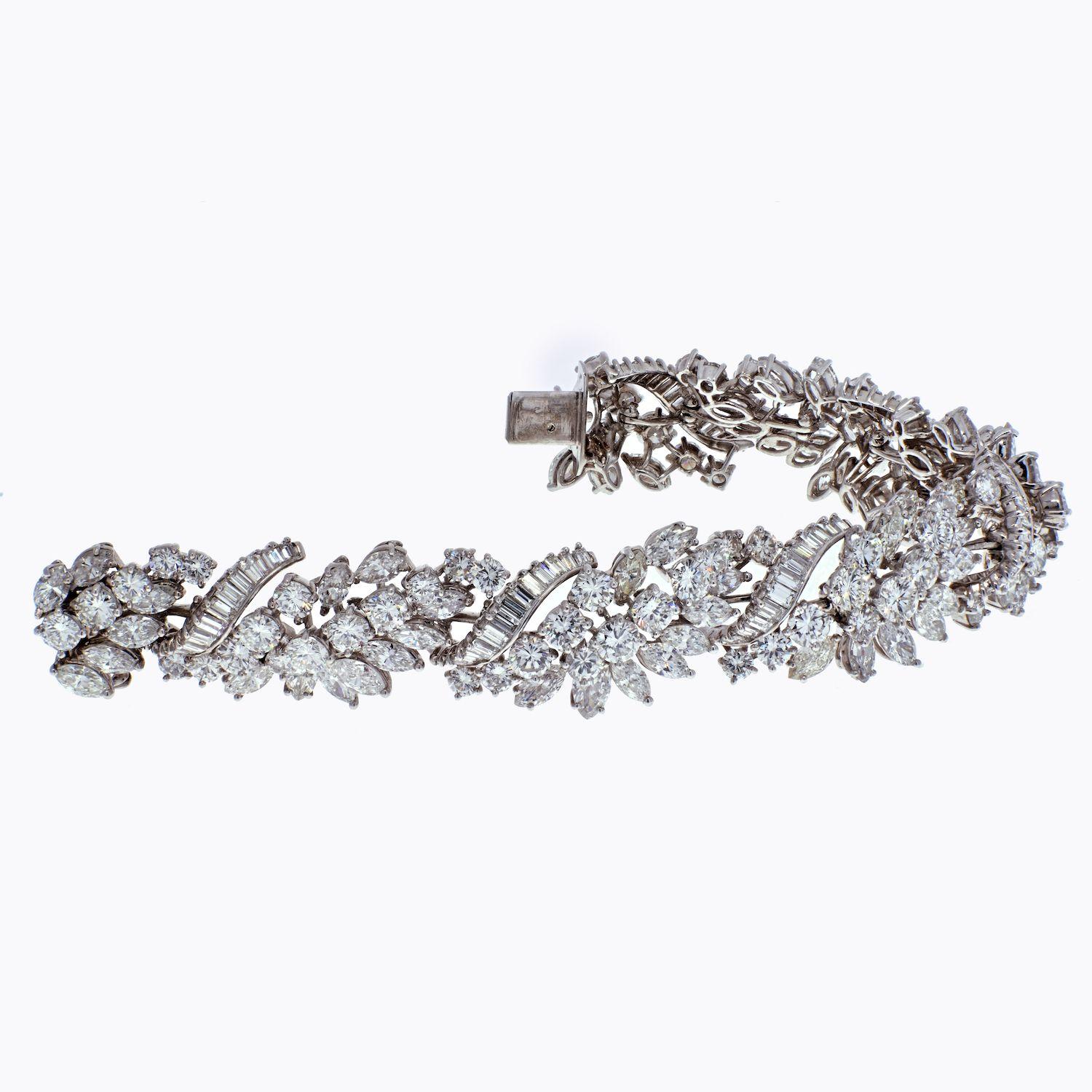 Platinum ladies diamond bracelet circa 1970's.
Crafted with round brilliant cuts, marquise cuts, and emerald cuts. 
Estimated carat weight: Rounds 20.00cts, Marquise Cuts 14.75cts, Emerald Cuts 5.25cts. 
Diamond quality: G-H color, VS1-VS2 clarity.