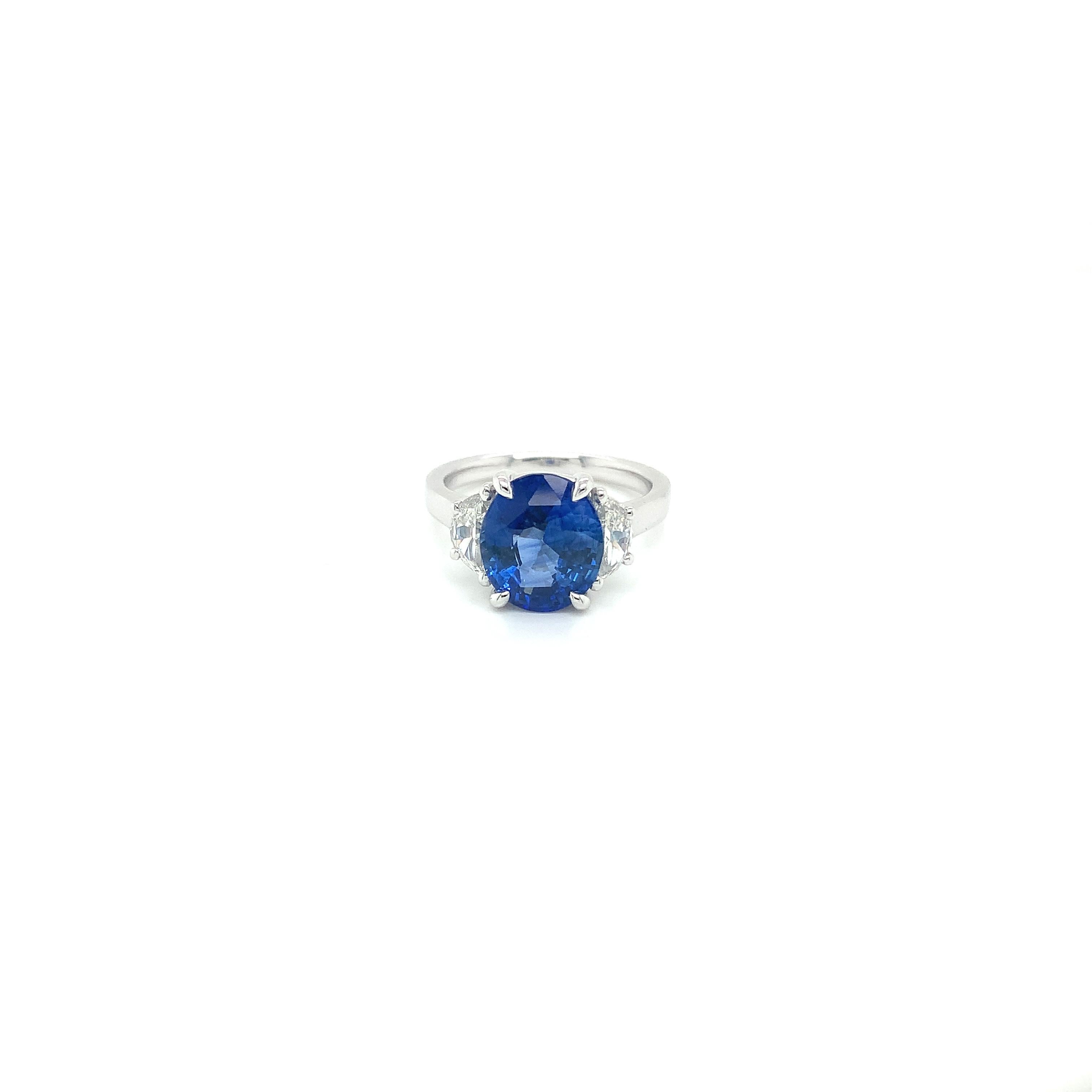 Oval blue sapphire weighing 4.24 cts
Measuring (10.7x9.3) mm
Two Diamonds weighing .77 cts
Measuring (6.8x3.4) mm
Set in Platinum Ring
8.31 grams