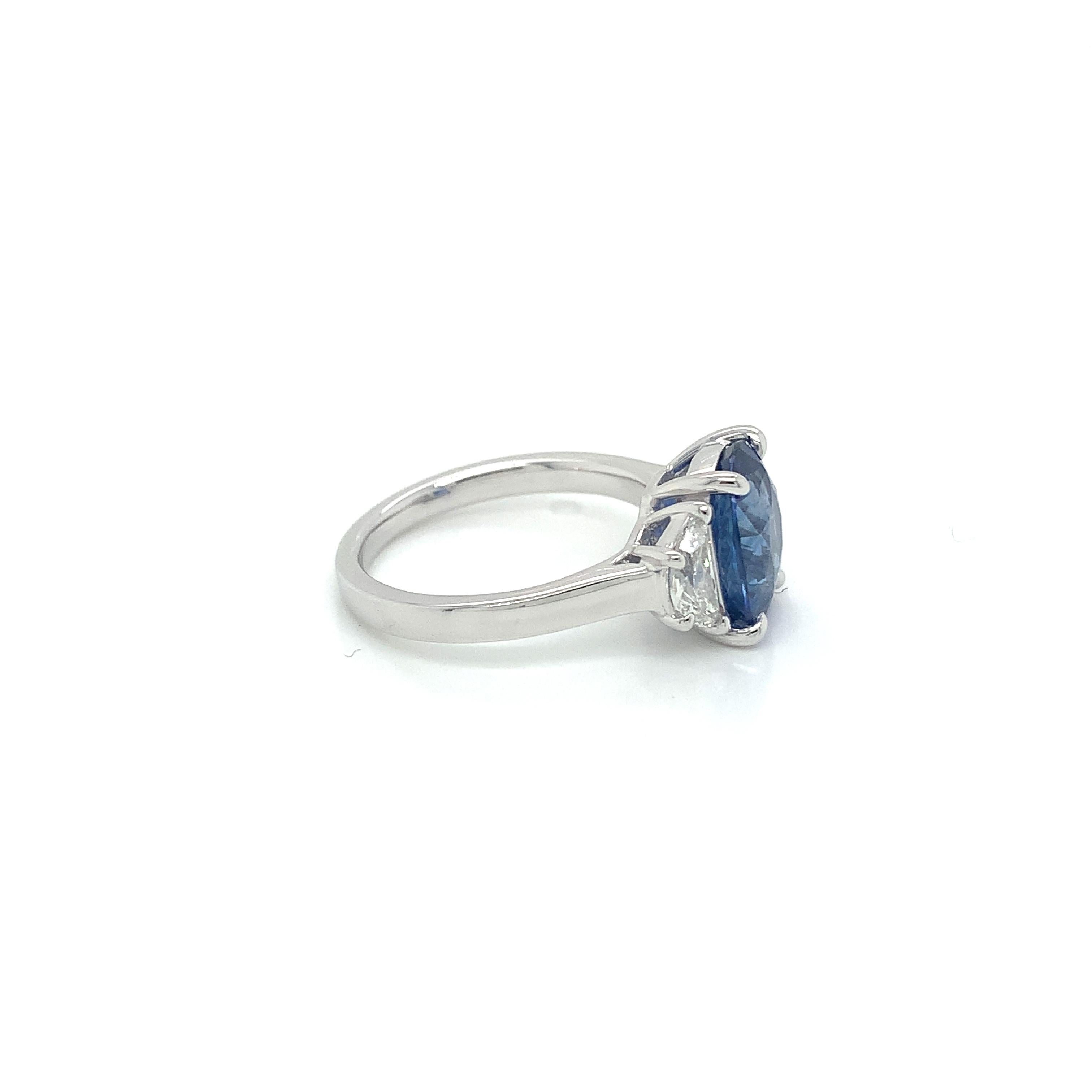 Oval Cut Platinum 4.24 Carat Blue Sapphire & Diamond Three Stone Ring For Sale