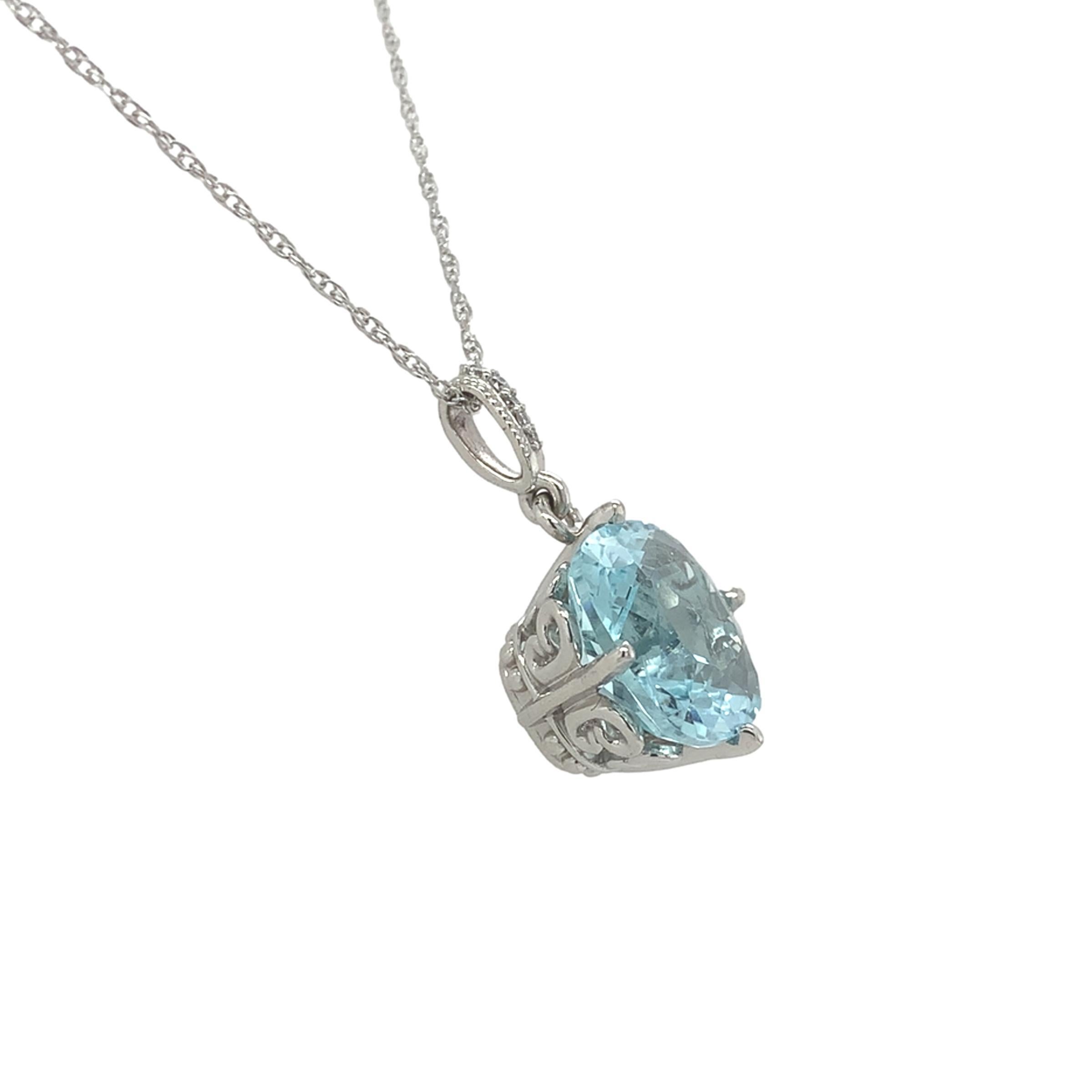Platinum pendant featuring a 4.75 carat genuine earth mined aquamarine. The aquamarine is a light sky blue color brilliant cushion cut measuring about 11mm. Accenting the bail are 5 tiny round diamonds weighing about .02cts total. The pendant