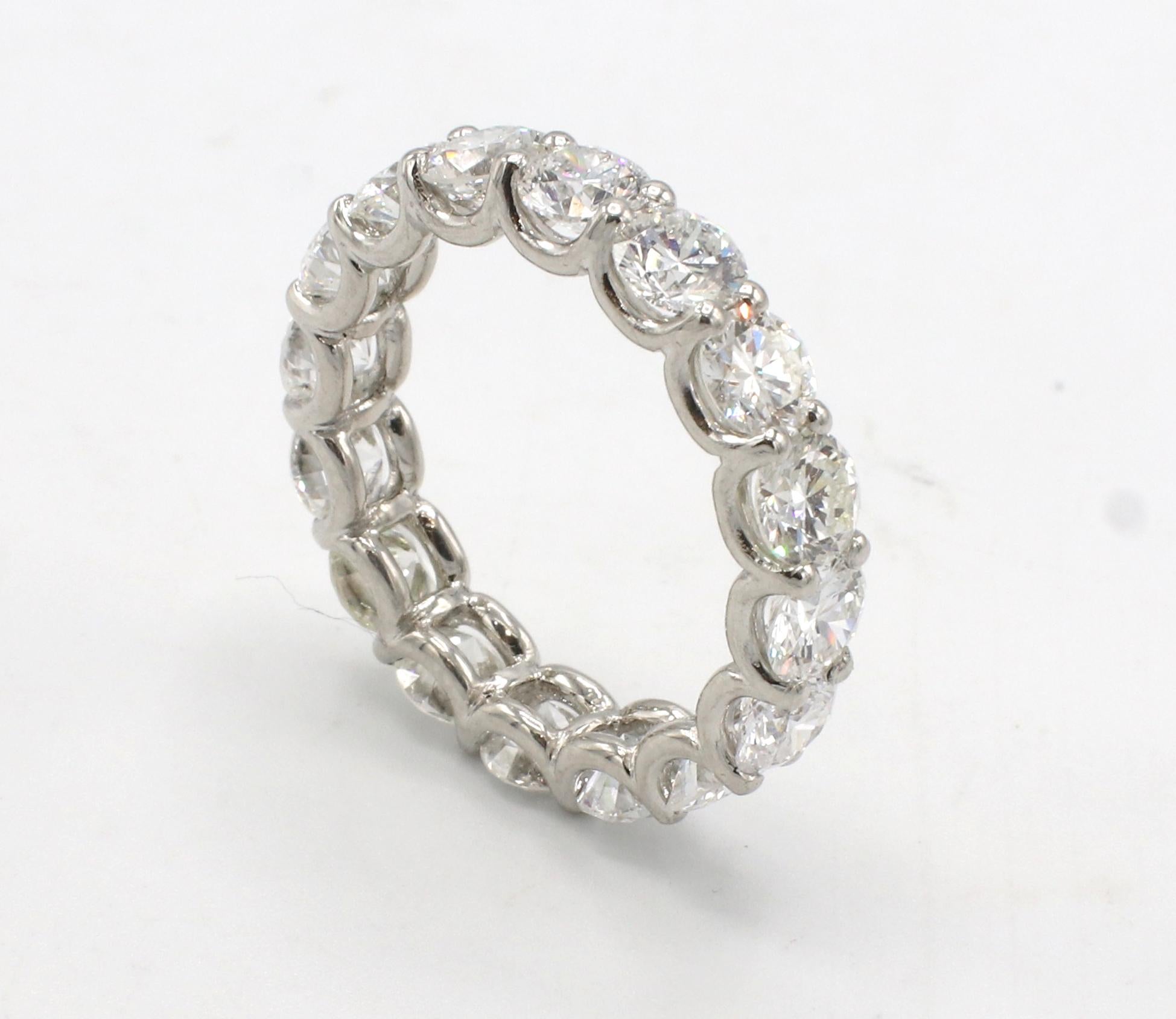 Platinum 4.88 Carat Round Natural Diamond Eternity Band Ring 
Metal: Platinum
Weight: 5.88 grams
Diamonds: 4.88 carats G-H VS (16 round brilliant natural diamonds)
Size: 6.25 (US)
