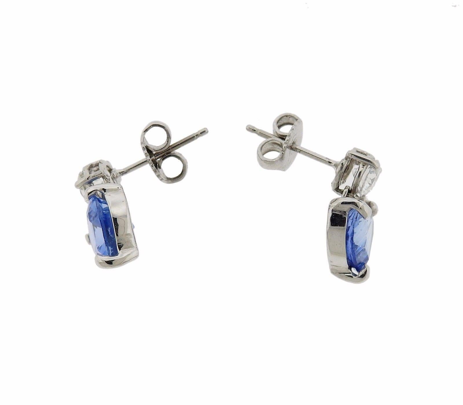 Beautiful and delicate platinum earrings, set with AGL certified heart shaped cornflower sapphires - total approx. 4.90ctw, and 0.60ctw in VS/GH diamonds. Earrings are 15mm x 10mm, weigh 3.7 grams. 
Come with AGL certificate for the sapphires.
