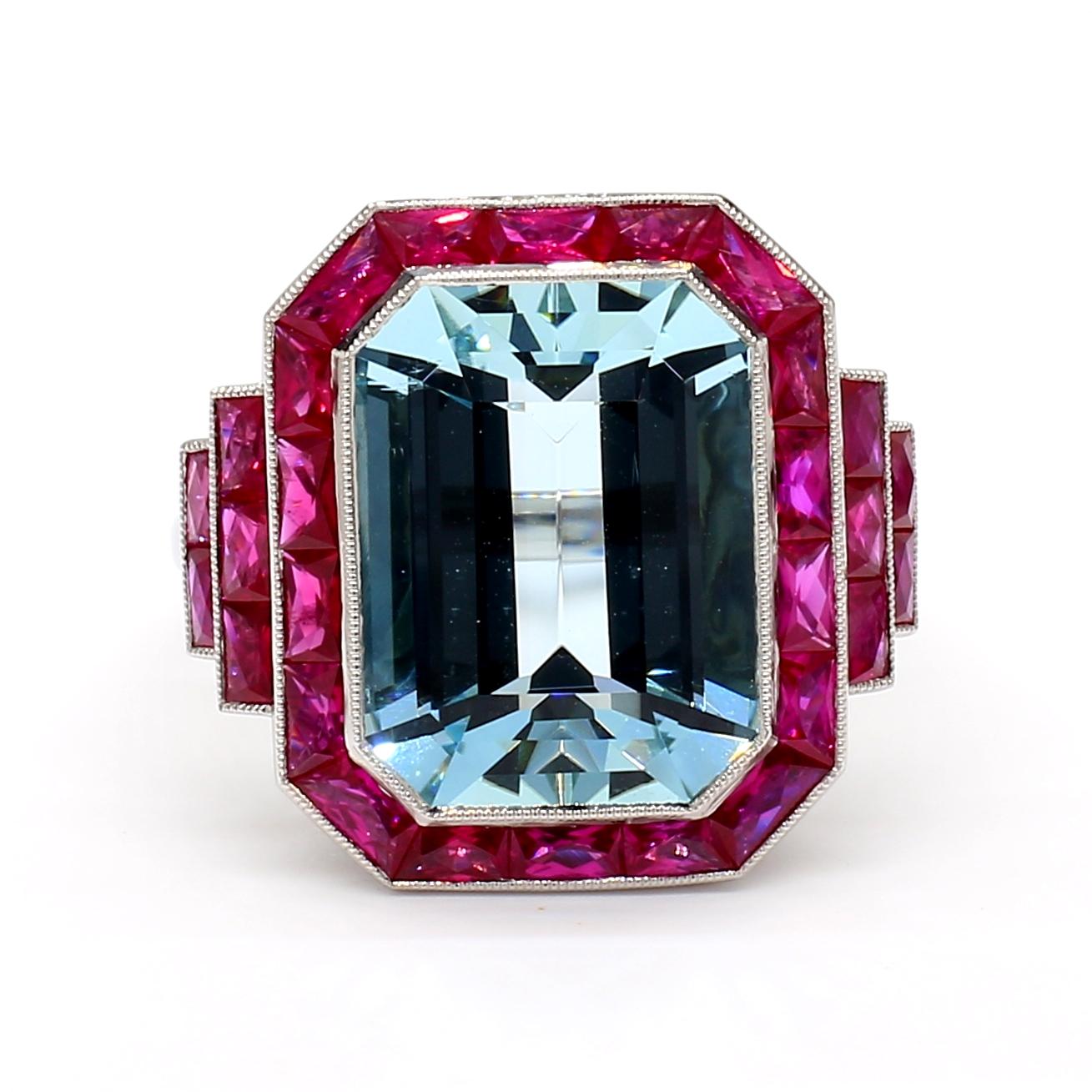 Exquisitely crafted with precision and elegance, the platinum 5.91 CTS Aquamarine Ring is a true masterpiece. Adorned with French-cut rubies weighing 1.63 CTS in an Art Deco style mounting, this stunning piece exudes beauty and timelessness. The