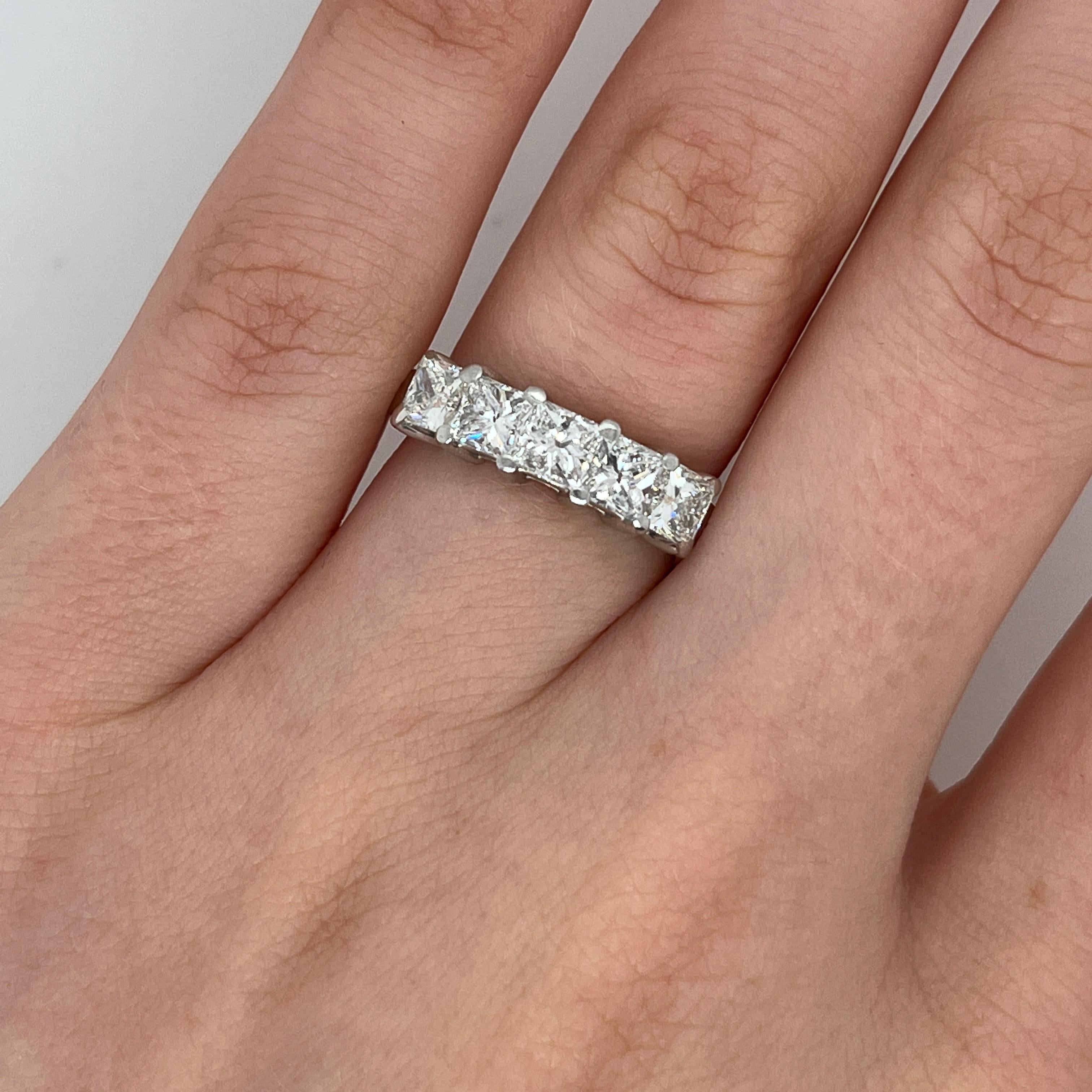 Elegant and timeless, this platinum ring features five stunning natural princess cut diamonds.
The diamonds are securely claw-set across the band, 
offering maximum brilliance and sparkle. 
Total Diamond Weight: 1.45ct
Diamond Colour: G/H
Diamond